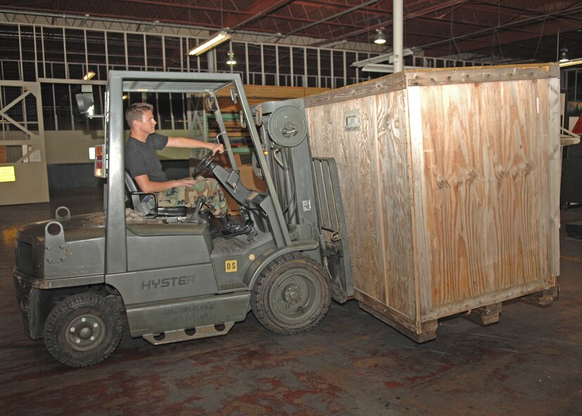 SEYMOUR JOHNSON AIR FORCE BASE, N.C. - Airman 1st Class Brett Moeller, 4th Logistics Readiness Squadron, drives a forklift with a crate of aircraft parts in it to be stored in the LRS warehouse on August 1. (U.S. Air Force photo by Senior Airman Jessica Klingler) 