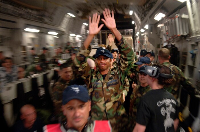 Airmen from the 437th and 315th Airlift Wings celebrate receiving the award for best C-17 maintenance team, best aerial refueling team and best C-17 airdrop aircrew
at the 2007 Rodeo on a C-17 after landing on the Charlesot AFB flightline Saturday. (U.S. Air Force photo/Airman 1st Class Nicholas Pilch) 
