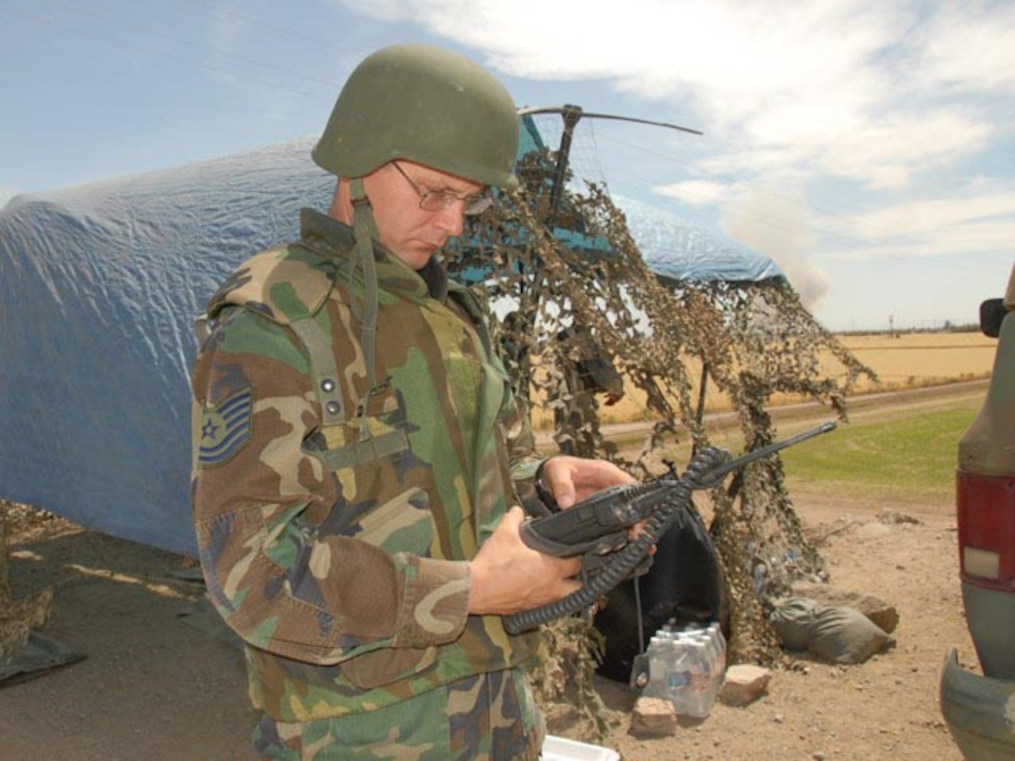 Technical Sgt. Robert Stefko, 119th Communications Flight and assigned to Task Force Yuma, works on radio communication systems at an entry identification team site near the U.S.-Mexico border June 5, 2007. Sergeant Stefco is working on Operation JUMP START as a communications specialist who manages radio and computer systems in the forward operating area along the Arizona-Mexico border.  (USAF photo by Senior Master Sgt. David H. Lipp)
