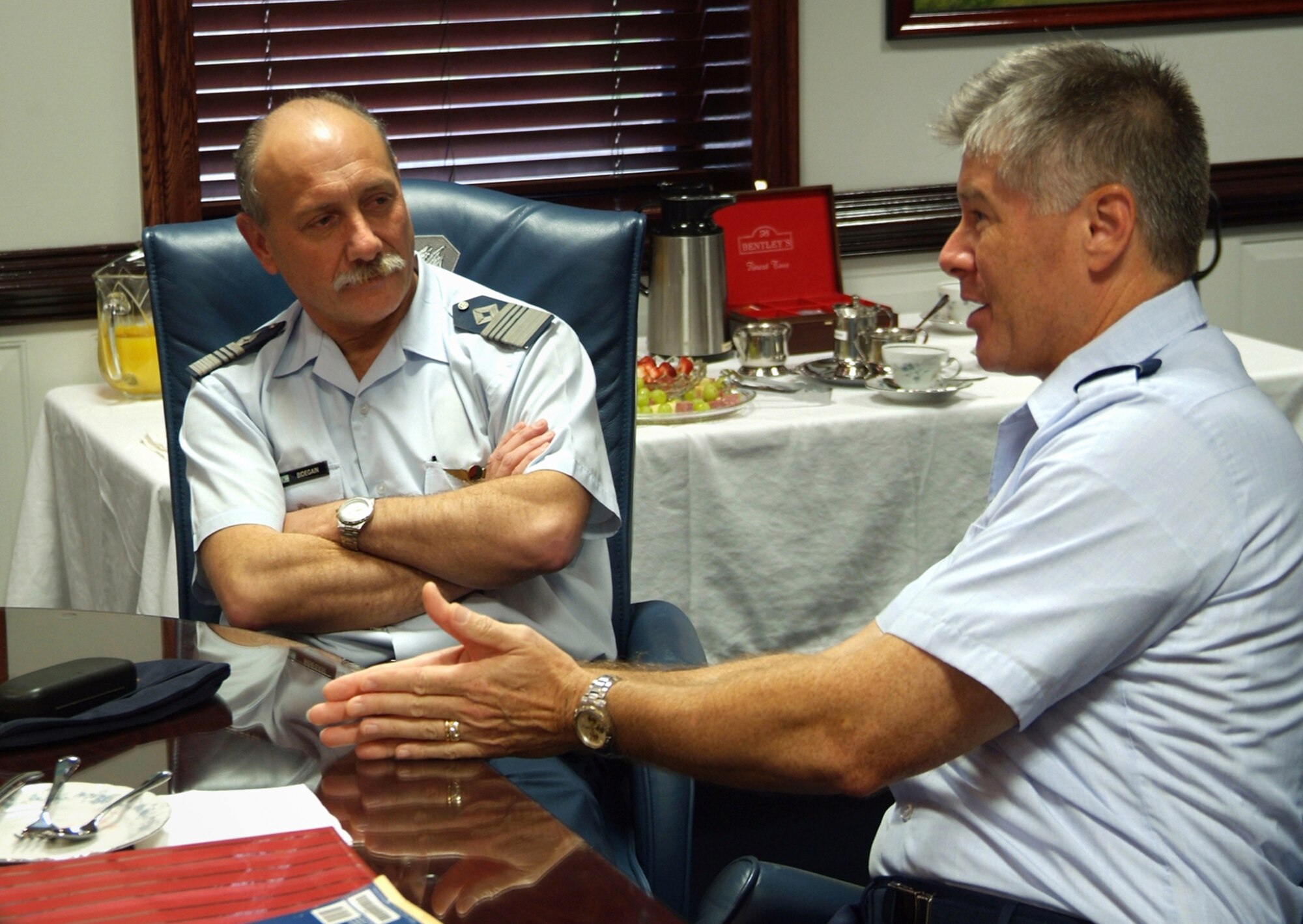 Col. Gerardo Bidegain, left, of the  Argentine Air Force, and Col. Richard Pierce, 81st Training Wing vice commander, discuss similarities and differences between the U.S. and Argentine services July 23 in the 81st TRW conference room.  Colonel Bidegain and two other Argentine officers visited Keesler July 23-25.  (U.S. Air Force photo by Adam Bond)
