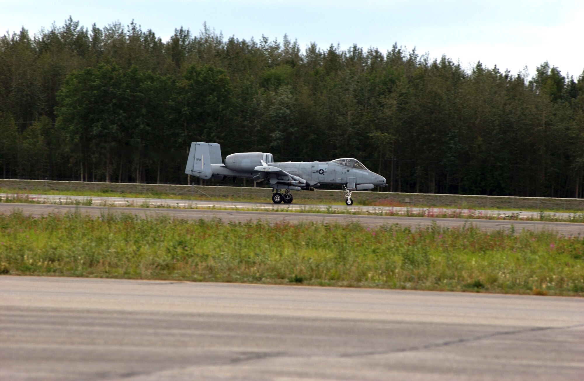An A-10 Thunderbolt II from the 355th Fighter Squadron lands after the last flight at Eielson Air Force Base, Alaska, July 31. The first two A-10s arrived at Eielson Dec. 18, 1981; the last two A-10s are set to leave Aug. 15 for Moody AFB, Ga., and Gowen Field, Idaho. (U.S. Air Force photo/Airman 1st Class Jonathan Snyder) 
