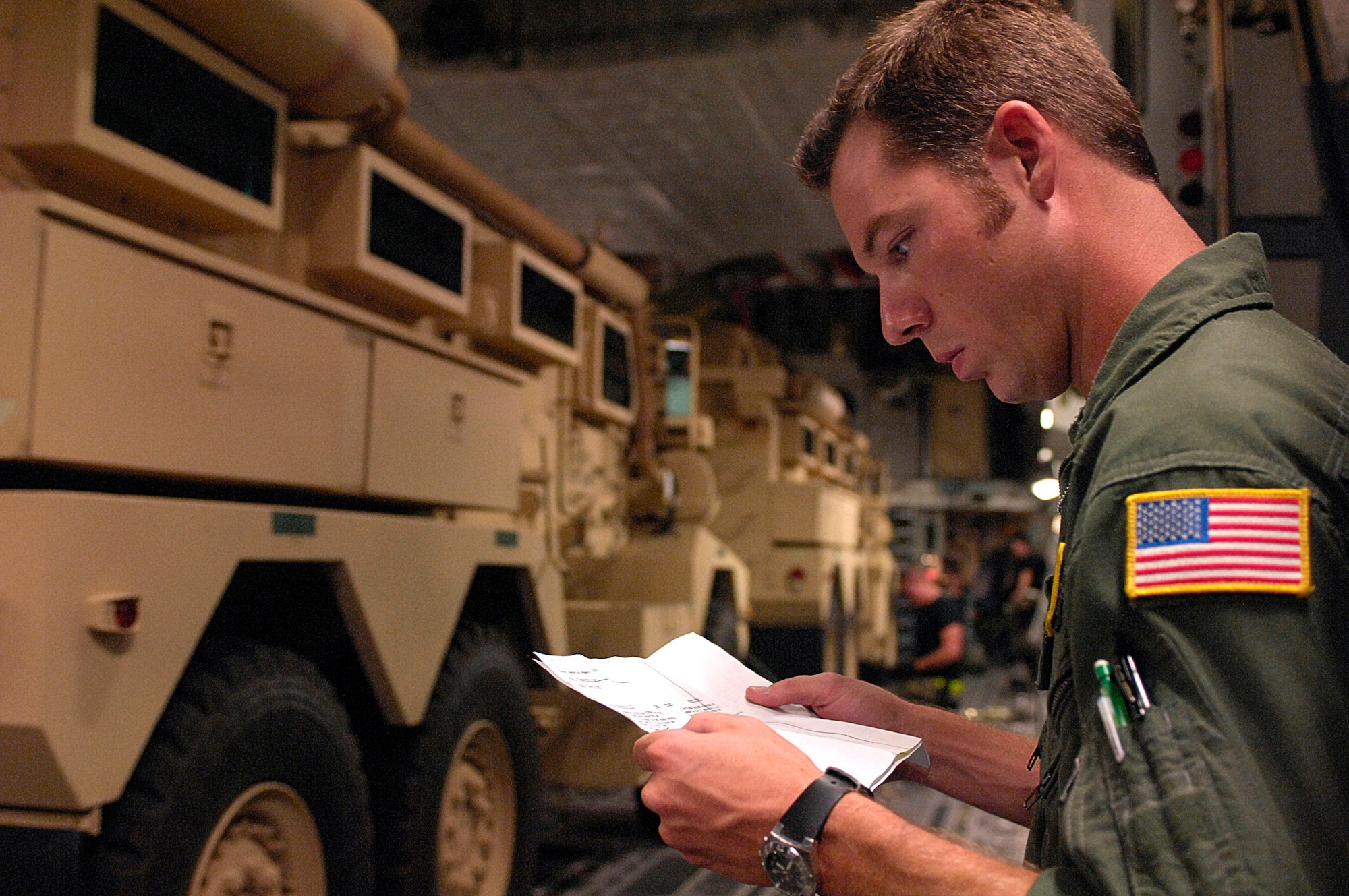 Tech. Sgt. Brad Hughes double-checks the load information on a pair of Mine Resistant Ambush Protected armored vehicles after they are loaded on a C-17 Globemaster III at Charleston Air Force Base, S.C., for shipment to Iraq July 28. An estimated 3,500 MRAP vehicles are expected to be in Iraq by Dec. 31. Sergeant Hughes is a loadmaster with the 317th Airlift Squadron. (U.S. Air Force photo/Tech. Sgt. Jeromy K. Cross)


