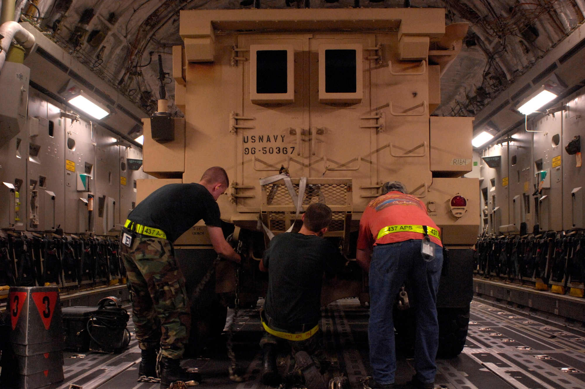 Airmen from the 437th Aerial Port Squadron at Charleston Air Force Base, S.C., chain down a Mine Resistant Ambush Protected armored vehicle on a C-17 Globemaster III for shipment to Iraq July 28. An estimated 3,500 MRAP vehicles are expected to be in Iraq by Dec. 31. (U.S. Air Force photo/Tech. Sgt. Jeromy K. Cross) 

