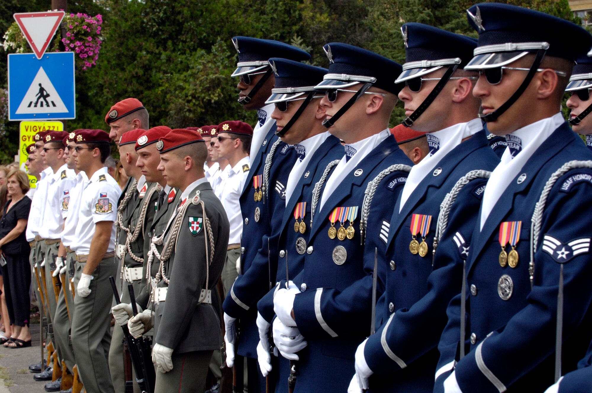 Members of the U.S. Air Force Honor Guard Drill Team stand next to armed forces from Austria and the Czech Republic. The team represented the U.S. armed forces at the Regimentfest in Miskolc City, Hungary, July 28. The Drill Team, the traveling component of the Air Force Honor Guard, is visiting three countries across central Europe. (U.S. Air Force photo/Senior Airman Daniel R. DeCook)