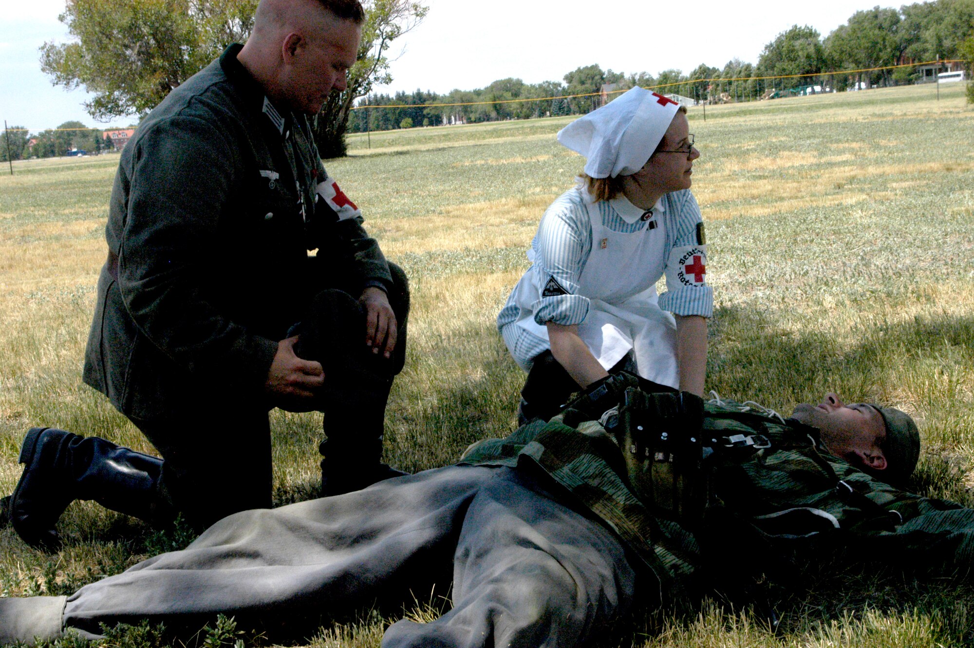 David Haake, German chaplain, and Amanda Stair, German medic, tend to the “mortally wounded” German soldier Jason Smith. The chaplain performed the last rites and listened to Mr. Smith’s last confessions and requests.