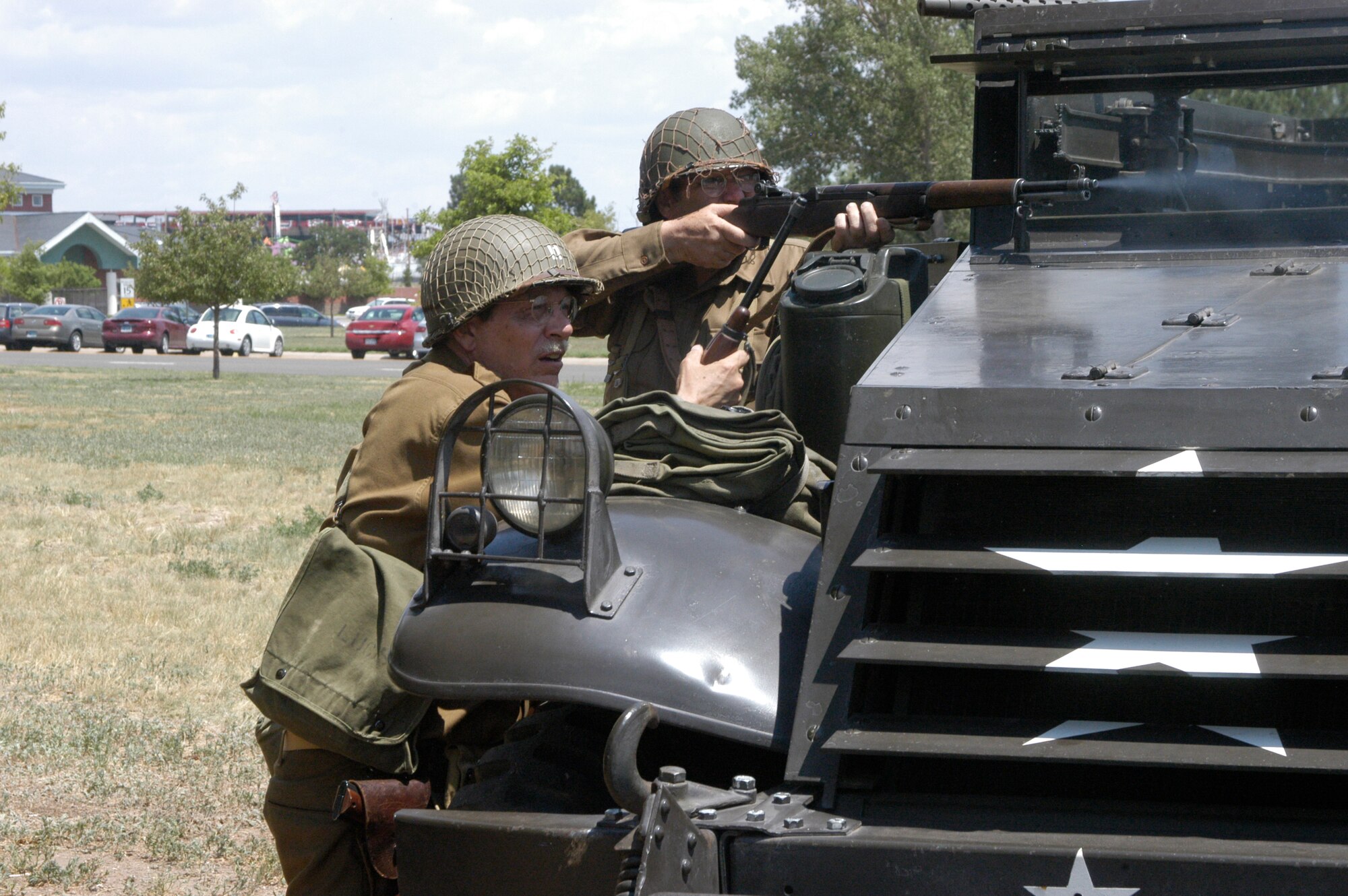 Lanier Lucas and Randy Cook, both American Soldiers, shoot at the Germans, aiding the escape of the captured French resistance members. The Americans arrived in a half-track from the period.