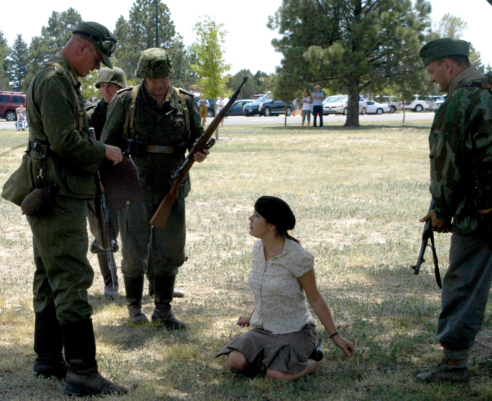 The German unit threatens Brianna Cook when they discover not only had she cut their communication line but had French resistance papers on her person.