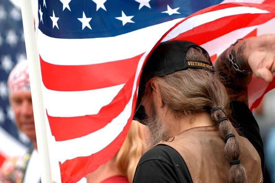 “Bear,” a Vietnam veteran and member of the Patriot Guard Riders waits at Ellsworth Air Force Base, S.D., for the return of 28th Bomb Wing Airmen after their 6 month deployment to Southwest Asia in support of Operations IRAQI FREEDOM and ENDURING FREEDOM, July 27, 2007.  The Patriot Guard Riders are a group of motorcycle riders that attend military events to show respect and shield the service member and family from interruptions caused by protestors. The guard integrated with Ellsworth’s honor guard to welcome home Ellsworth’s Airmen.  (U.S. Air Force photo/Staff Sgt. Michael B. Keller) (Released by Tech. Sgt. Steven Wilson, 28th BW/PA)
