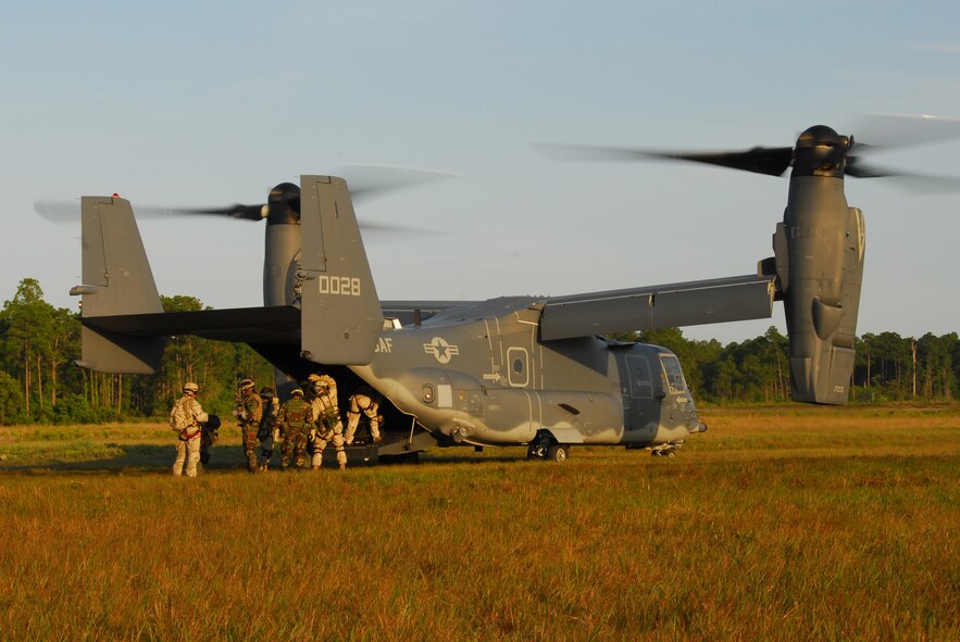 Air Force special tactics Airmen board a CV-22 Osprey at Hurlburt Field, Fla., May 22, 2007.  The tiltrotor Osprey flies like a conventional aircraft while taking off and landing like a helicopter.  The speedy, long-range CV-22 will be flown by Air Force Special Operations Command aircrews to insert and exfiltrate special operations forces on clandestine missions.  (US Air Force photo by Chief Master Sgt. Gary Emery) (Released)  