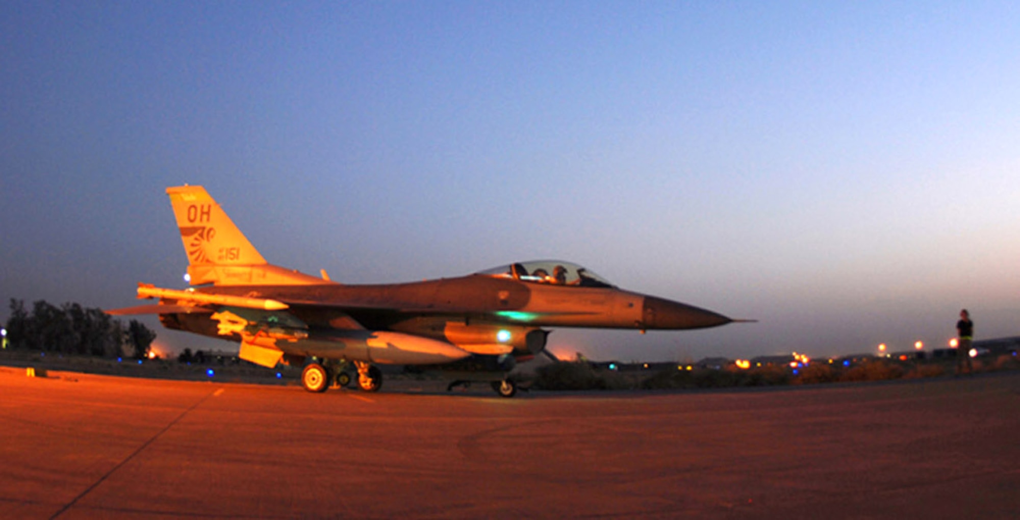An F-16 Fighting Falcon taxis out for a night operation at Balad Air Base Iraq.  F-16s fly close-air-support sorties for Operation Iraqi Freedom.   F-16s and other coalition aircraft contributed to the 49 close-air-support missions flown over Iraq July 31.  (U.S. Air Force photo)