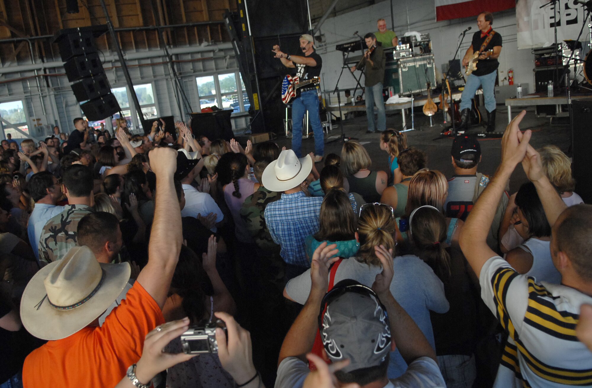 MOUNTAIN HOME AIR FORCE BASE, Idaho -- Aaron Tippin sings for the Gunfighter community July 31 during the 2007 Spirit of America Tour concert. The tour, founded in 2002 by Robert Rosenthal, brings free concerts to stateside, military installations to thank U.S. troops for all they do. (U.S. Air Force photo/Airman 1st Class Ryan Crane)