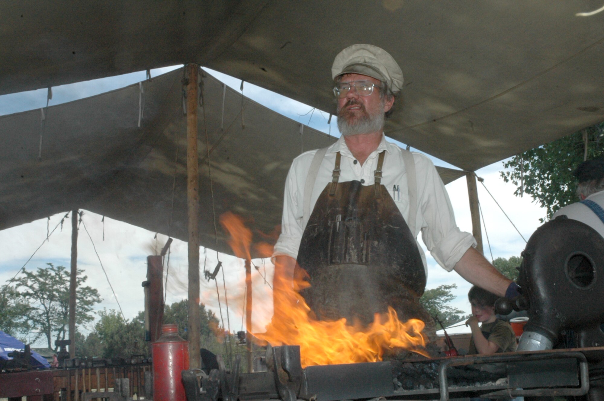 Jan Manning has been working Fort D.A. Russell Days as a blacksmith since 1981. He says this has been a hobby of his for years, and he has enjoyed smithing since this festival has started (Photo by Airman 1st Class Daryl Knee).