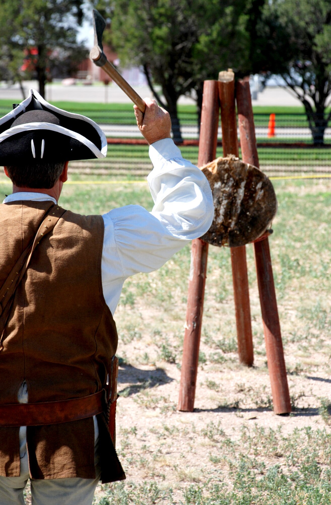 Rod Bergstrom demonstrates a proper tomahawk throw. Proper form is taking the tomahawk straight back, keeping the blade vertical and releasing forward (Photo by Staff Sgt. Chad Thompson).