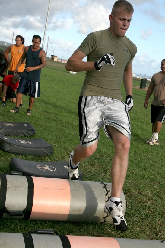 Robert Harling, Camp H.M. Smith Raider wide receiver, runs through callisthenic drills to warm up for football practice on Bordelon Field, Aug. 2.