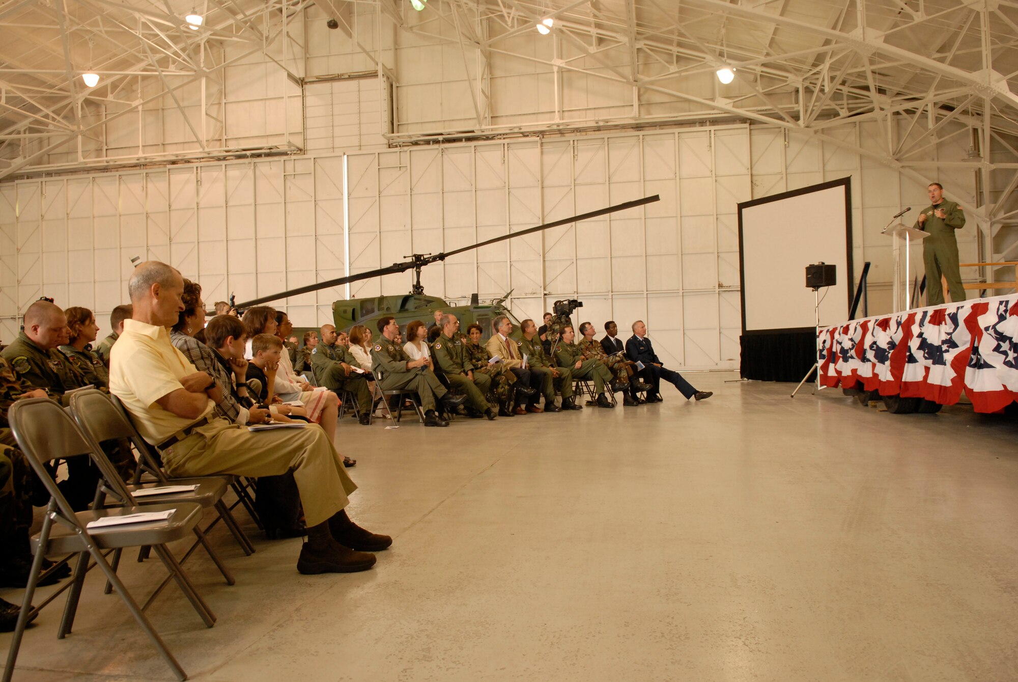 VANDENBERG AIR FORCE BASE, Calif. -- Maj. Timothy Anderson praises his team of pilots, flight engineers, support staff and contractors during the 76th HS inactivation ceremony at the hangar on Aug. 2. The squadron's final commander led a team that supported space launch, land and water rescue, fire suppression and many diverse training missions. (U.S. Air Force photo/Airman 1st Class Adam Guy) 
