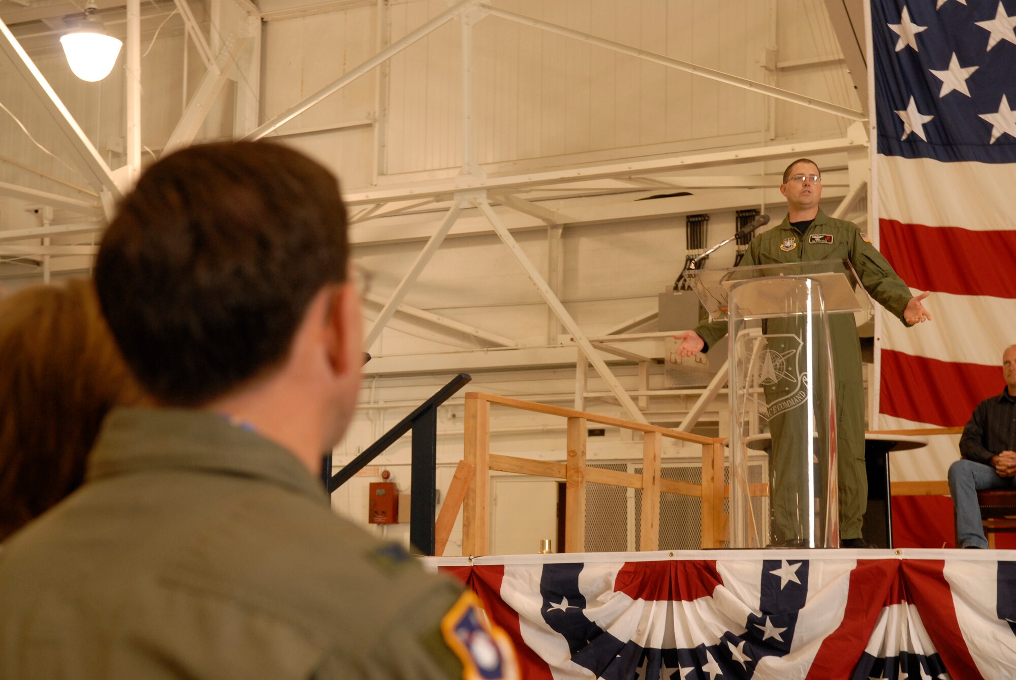 VANDENBERG AIR FORCE BASE, Calif. -- Col. Steve Tanous, 30th Space Wing commander, looks on as Maj.Timothy Anderson, the final commander of the 76th Helicopter Squadron, delivers his farewell speech during the inactivation ceremony for the 76th Helicopter Squadron at the hangar on Aug. 2.  The squadron supported space launch, land and water rescue, fire suppression and many diverse training missions. Launch security will continue to be maintained by the 30th Security Forces Squadron through the unmanned aerial vehicle program.  (U.S. Air Force photo/Airman 1st Class Adam Guy) 