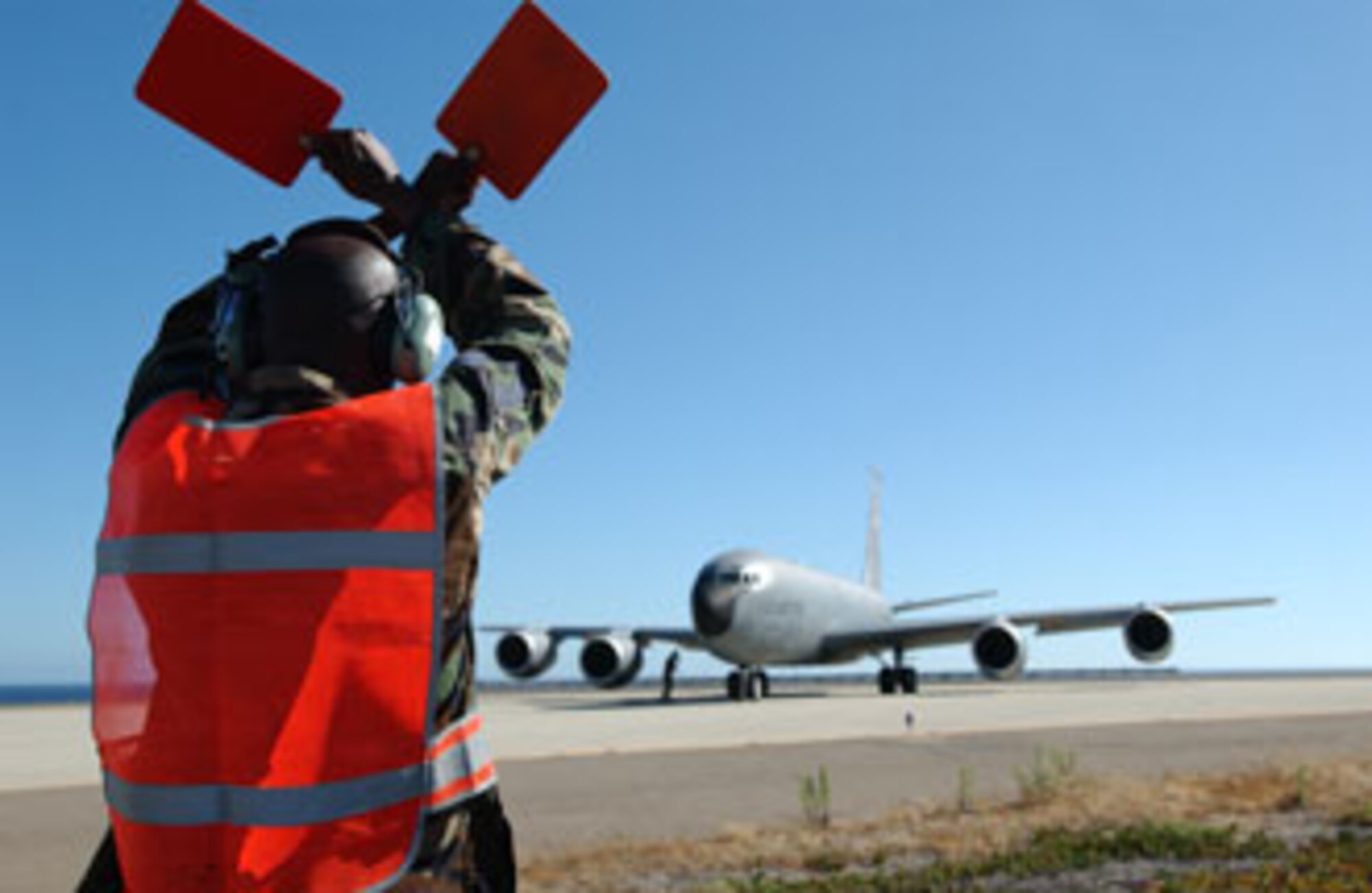 Tech. Sgt. Richard Williams, 752nd Aircraft Maintenance Squadron, marshals out a KC-135 Stratotanker, from the 336th Air Refueling Squadron,  at San Clemente Island, Calif., during exercise Patriot Hook 2007.
U.S. Air Force Photo by Staff Sergeant Francisco V. Govea II            
