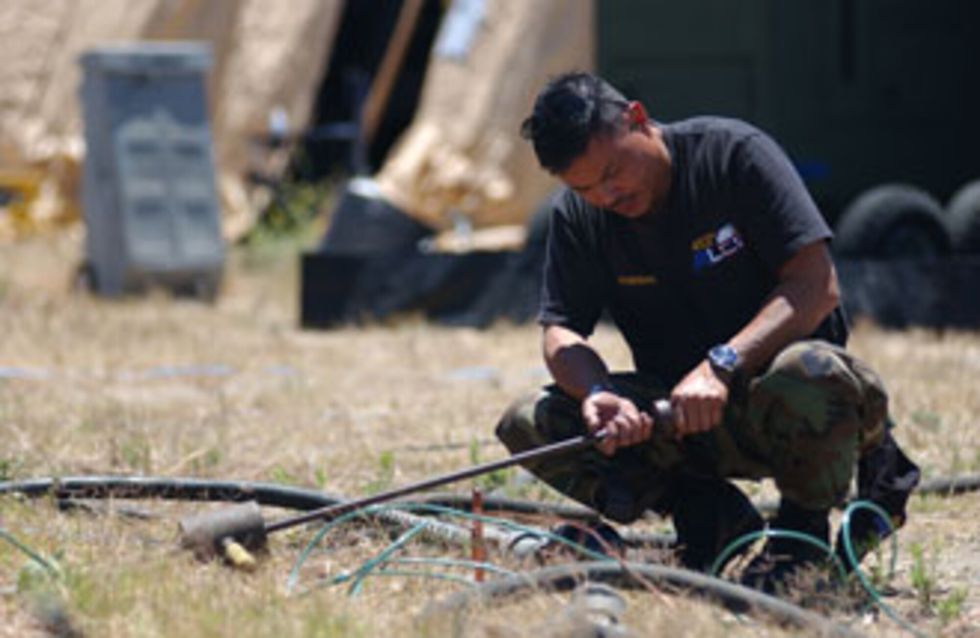 Tech. Sgt. Reynaldo Gumarang, a KC-135 Stratotanker Boom Operator from the 452nd Air Lift Control Flight, sets up communications at San Clemente Island, Calif. Sergeant Gumarang was participating in Patriot Hook 2007, a joint services exercise led by the Air Force Reserve Command.
U.S. Air Force photo by Staff Sgt. Mary D. Woolstenhulme