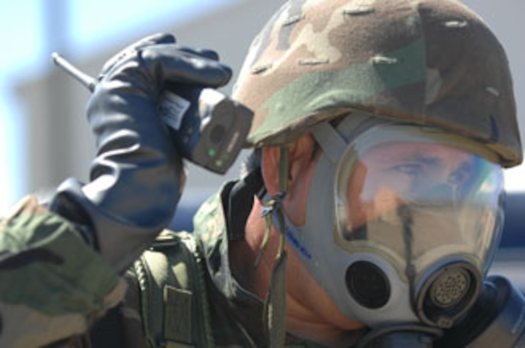 An Airman from March Air Reserve Base, Calif., calls in the location of an unexploded ordnance while at San Clemente Island, Calif., participating in exercise Patriot Hook 2007.
U.S. Air Force photo by Staff Sgt. Francisco V. Govea II