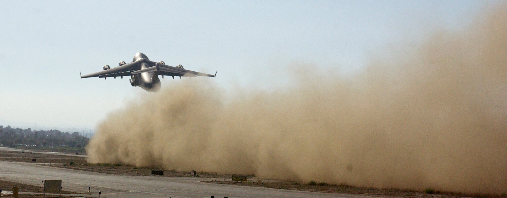 A C-17 Globemaster III from the 729th Airlift Wing conducted various combatmaneuvers for the film crew at the Riverside Airport