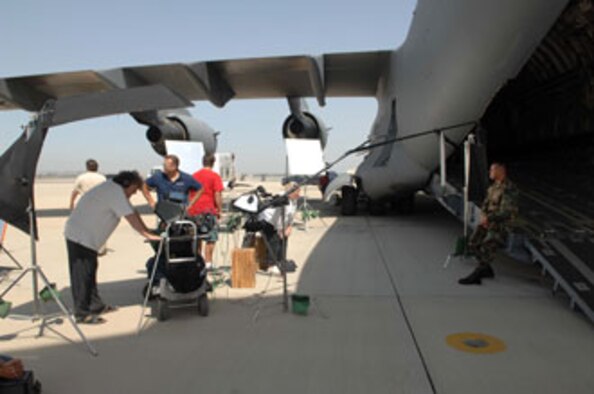 March Air Reserve Base hosted a film crew shooting a national public service announcement for Air Force Reserve Command July 20 and 21.  The filming began at the Riverside Airport where Lt. Col. David Rand and Maj. Tom Stottman piloted a C-17 Globemaster III from the 729th Airlift Squadron.  Saturday morning the shoot continued as the 452nd Civil Engineering Squadron simulated a flight line repair.  Senior Airman Neal Duenas and Staff Sgt. Louie Morales, both from the 56th Aerial Port Squadron, were chosen by their unit for the individual interview portion of the filming.  Afterwards, the 56th APS was shot loading a C-17.  The filming ended Saturday afternoon with a mock homecoming scene featuring military members from March Field along with their family members.
U.S. Air Force photos by: 4th Combat Camera