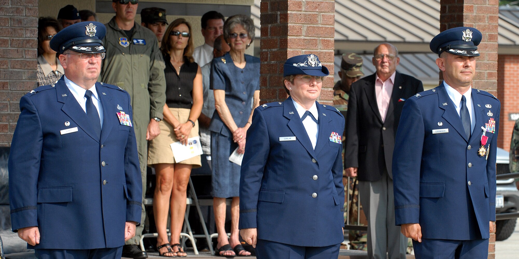 From left to right: Col. Richard Ayres, 17th Training Wing commander; Col. Ada Conlan, 17th Mission Support Group commander, and Col. Stephen Czerwinski, former 17 MSG commander, stand at attention for the playing of the Air Force Song during the 17 MSG Change of Command ceremony Tuesday. (U.S. Air Force photo by Tech. Sgt. Gina O’Bryan)