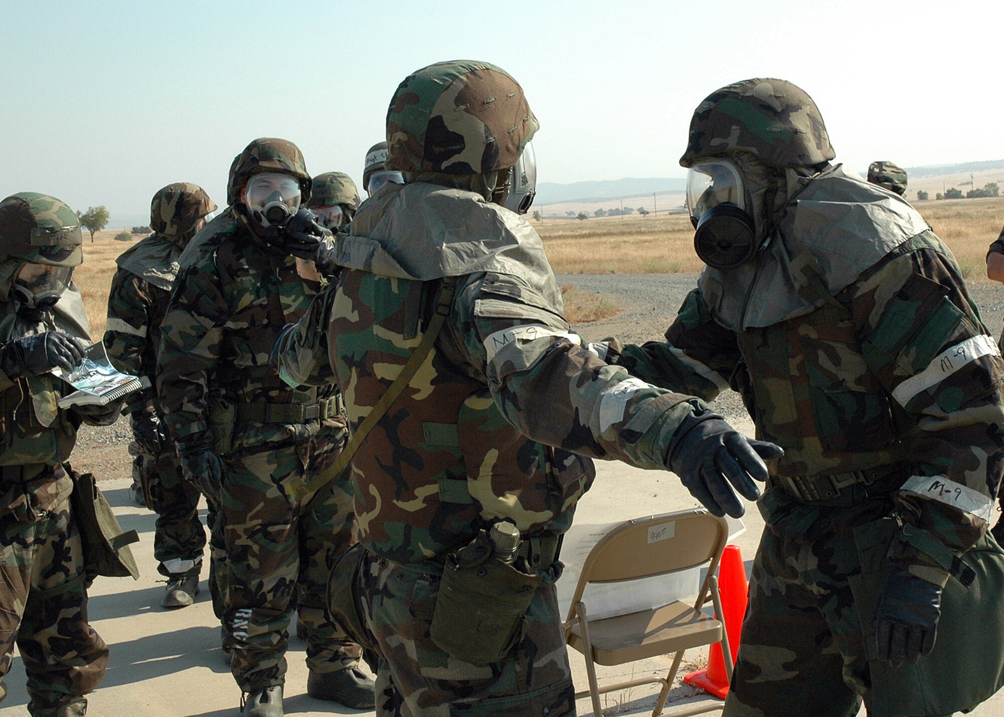 Air Force Reservists from the 940th Air Refueling Wing at Beale Air Force Base, Calif., train on proper decontamination techniques in a simulated combat environment during an ability to survive and operate exercise July 8, 2007. the exercise is designed to help the 940th ARW prepare for an Operational Readiness Inspection in February 2008. (U.S. Air Force photo/Staff Sgt. Luke Johnson)