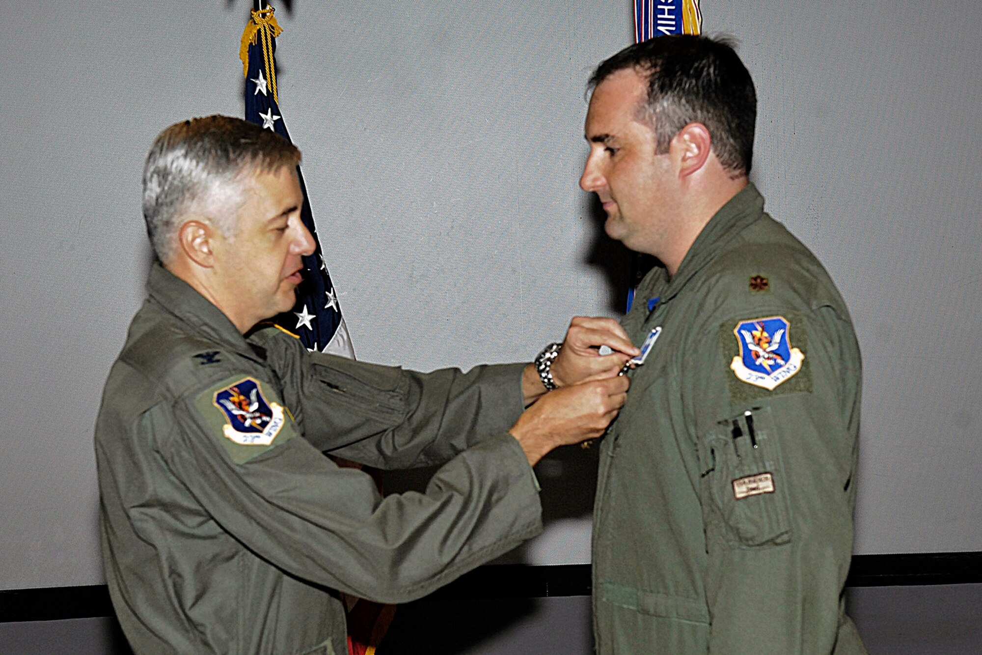 Col. Kenneth Todorov pins the Distinguished Flying Cross on Maj. Keith Wolak during an award ceremony at Pope Air Force Base, N.C., July 27. Major Wolak is an A-10 Thunderbolt II pilot with the 23rd Fighter Group at Pope AFB. Colonel Todorov is the 23rd Wing commander at Moody Air Force Base, Ga. (U.S. Air Force photo/Mike Murchison)