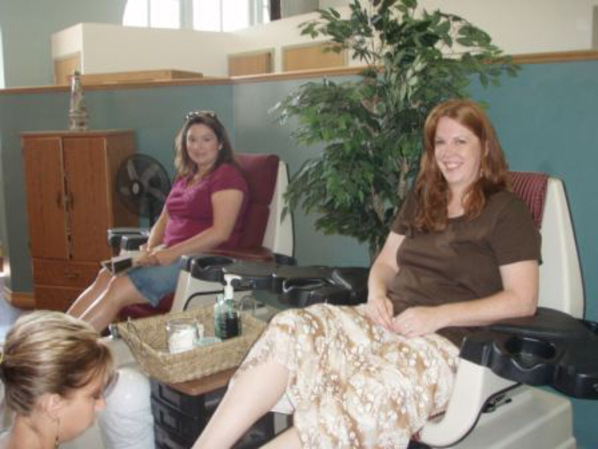 GRAND FORKS AIR FORCE BASE, N.D. -- Military spouses enjoy a pedicure at a local spa while their husbands are deployed. The event was made possible by a donation from TriWest. In addition to the visit to the spa, free childcare at the children's development center here was offered by a donation from the Air Force Aid Society. (courtesy photo)
