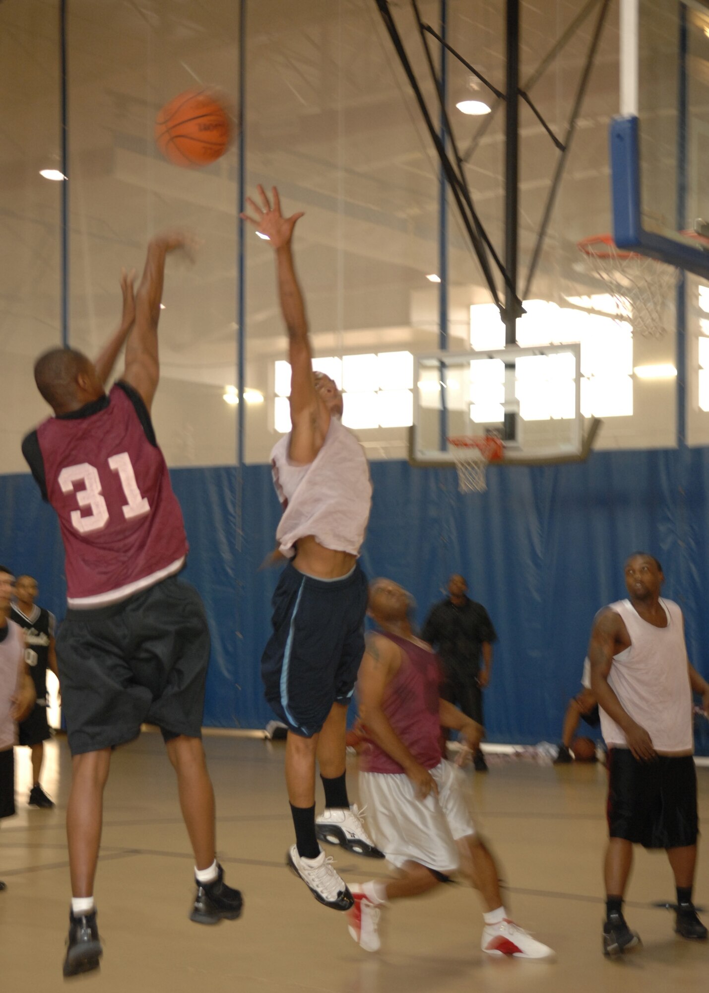 Airman Jarad Hudgies shoots a basket during the Summer League Tournament championship game. The 49th Maintenance Squadron beat out the 49th Aircraft Maintenance Squadron 60-49. Airman Hudgies is on the 49 AMXS team. (U.S. Air Force photo/Airman 1st Class Rachel Kocin)