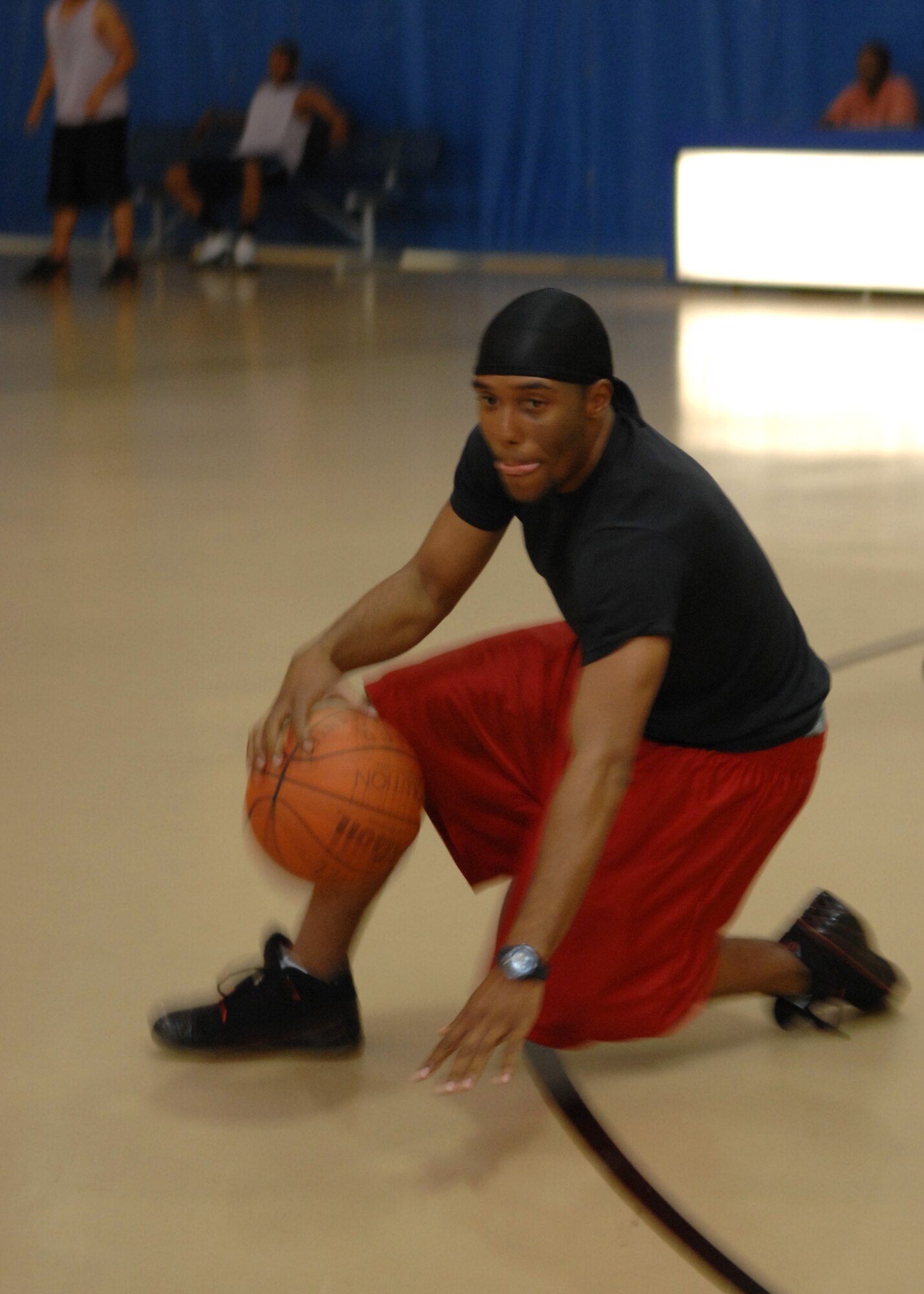 Airman 1st Class Tyren Ball goes down to dribble during the Summer League Tournament championship game. The 49th Maintenance Squadron beat out the 49th Aircraft Maintenance Squadron 60-49. (U.S. Air Force photo/Airman 1st Class Rachel Kocin)