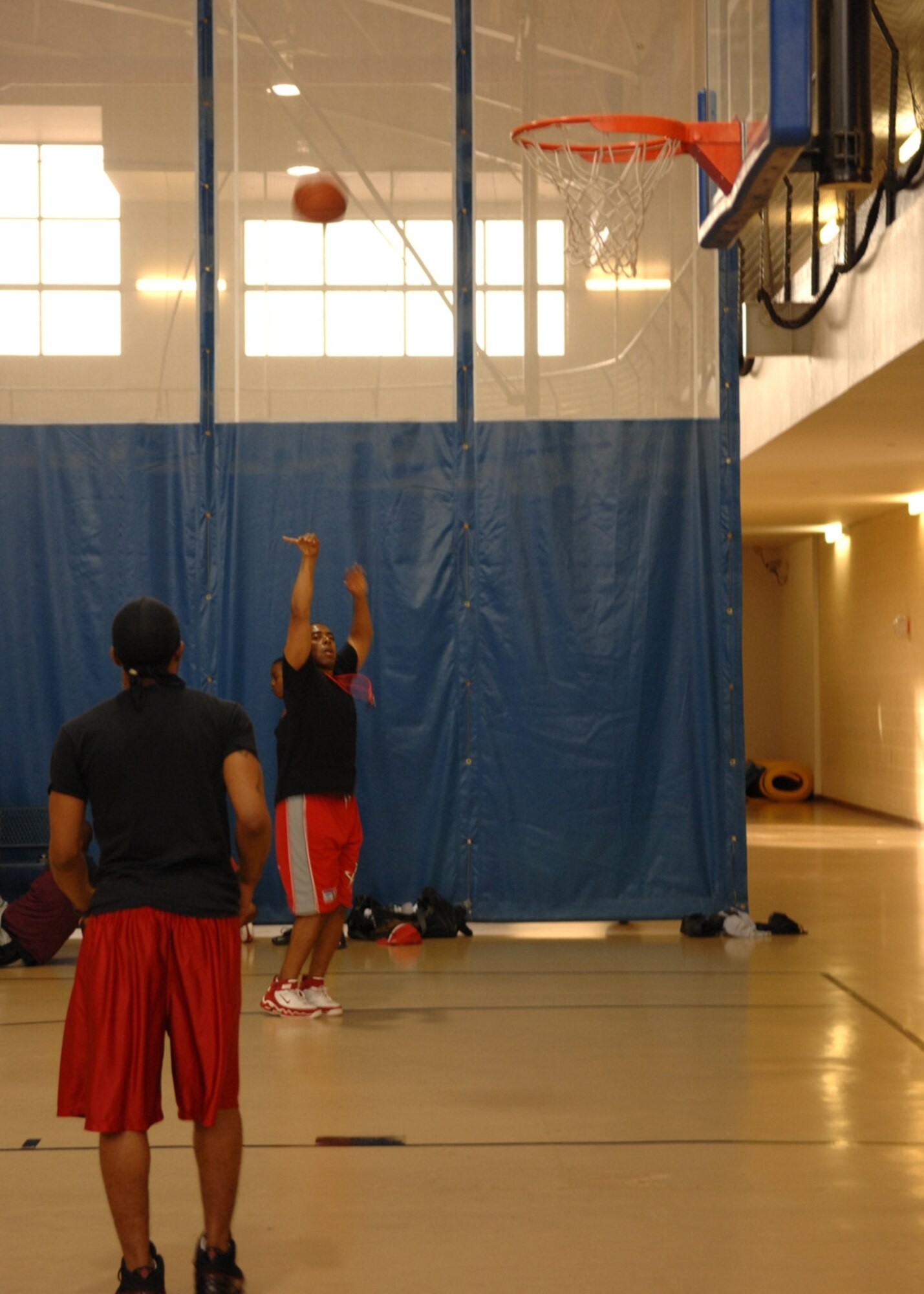 Master Sgt. LaValle Hinton shoots a three-point shot during the Summer League Tournament championship game. The 49th Maintenance Squadron beat out the 49th Aircraft Maintenance Squadron 60-49. Sergeant Hinton is on the 49 AMXS team. (U.S. Air Force photo/Airman 1st Class Rachel Kocin)