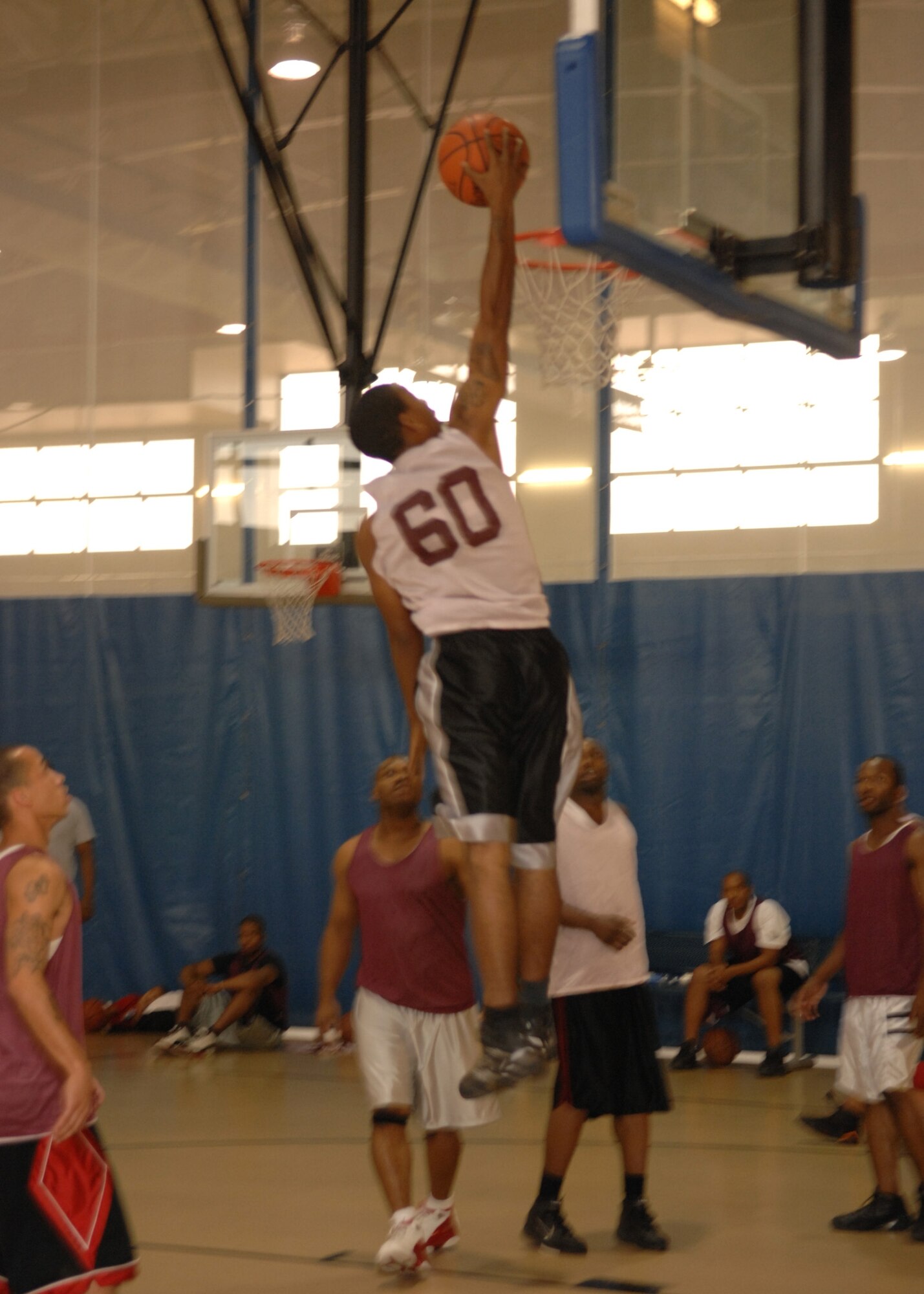 Airman 1st Class Christopher Napier goes up for a lay up during the Summer League Tournament championship game. The 49th Maintenance Squadron beat out the 49th Aircraft Maintenance Squadron 60-49. Airman Napier is on the 49 MXS team. (U.S. Air Force photo/Airman 1st Class Rachel Kocin)