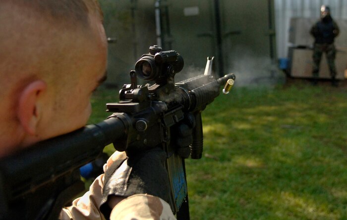Staff Sgt. Joshua Rance, 437th Security Forces Squadron training instructor, fires a training ammunition at a training target on the Charleston AFB training field July 27.(U.S. Air Force Photo/Airman 1st Class Nicholas Pilch)