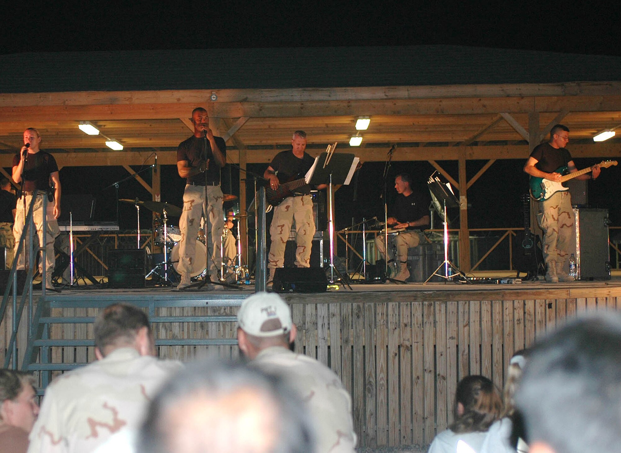 CENTAF band performs a concert for deployed Servicemembers at the Kandahar Airfield boardwalk stage in Afghanistan. The CENTAF band played two concerts for the Servicemembers July 29 and 30. (Army photo by Sgt. Tony Spain 22nd Mobile Public Affairs Detachment)
