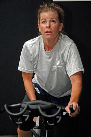 Jennifer Kindernay leads her FTAC class during their scheduled physical training time in a spinning session Tuesday. (U.S. Air Force Photo/Staff Sgt. April Quintanilla)