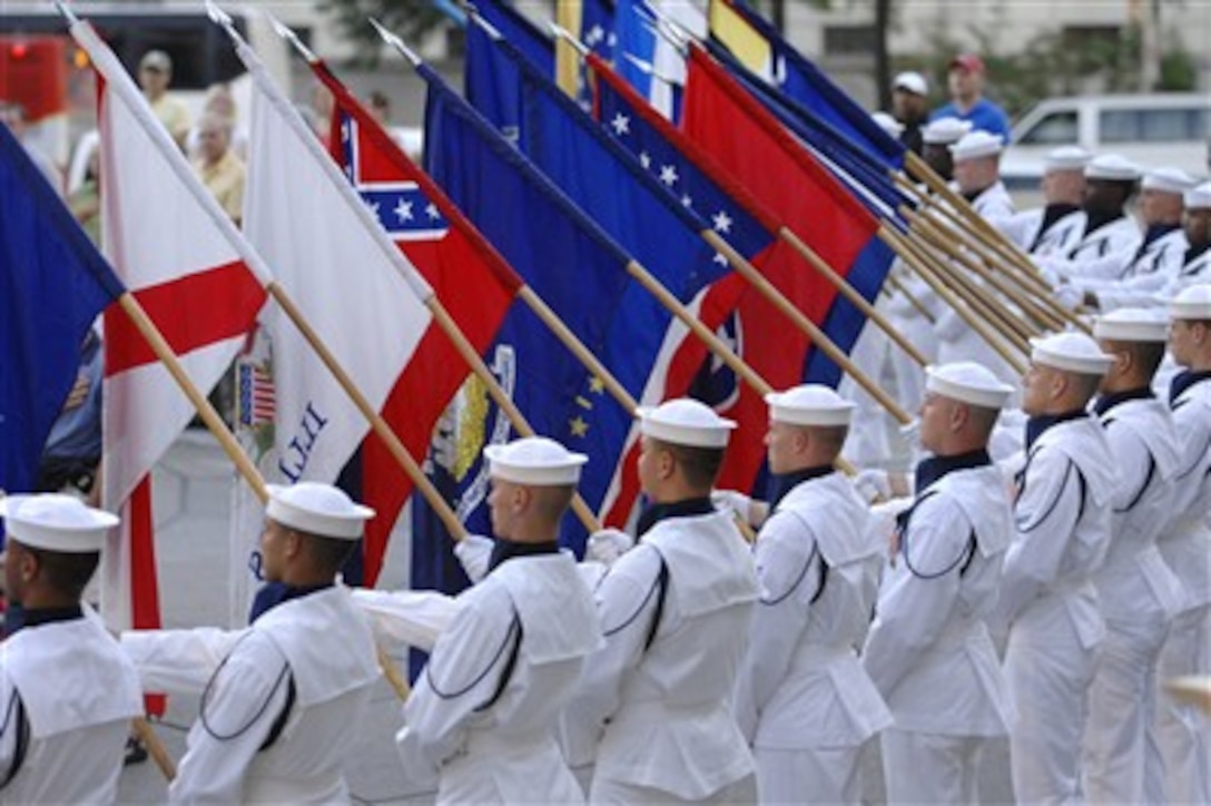 The Navy Ceremonial Honor Guard renders honors during the National Anthem for the commencement of the Navy District Washington's Concert on the Avenue in Washington, D.C., on July 31, 2007.  The Navy Band performs on the Memorial Plaza every Tuesday night between Memorial Day and Labor Day.  