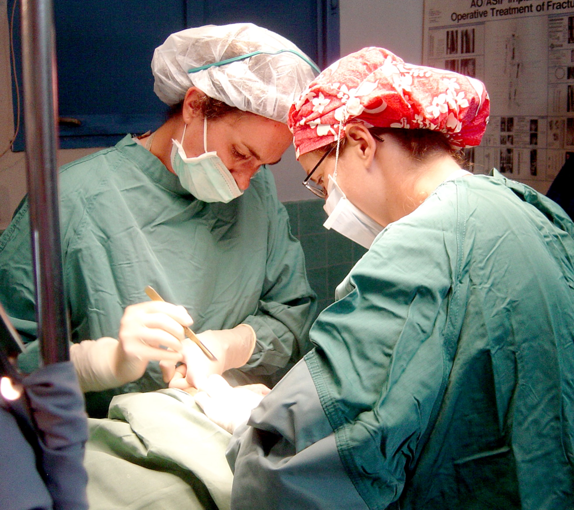 Cmdr. (Dr.) Amy O'Boyle, an Obstetrics/Gynecological Surgeon, and Lt. Jennifer Ftiscar, an OB/GYN resident – both from Naval Medical Center Portmouth, Va., perform surgery on a local woman at Espiritu Santo hospital in Vanuatu. They were part of an Obstetrics/Gynecological surgical team which visited Espiritu Santo island in the nation of Vanuatu to train medical staff and perform surgery. The team was part of the Oceania Humanitarian Assistance Mission that brought medical, dental and engineering personnel to perform civil assistance projects on Vanuatu, Nauru and Kiribati July 20-30. (U.S. Air Force Photo)