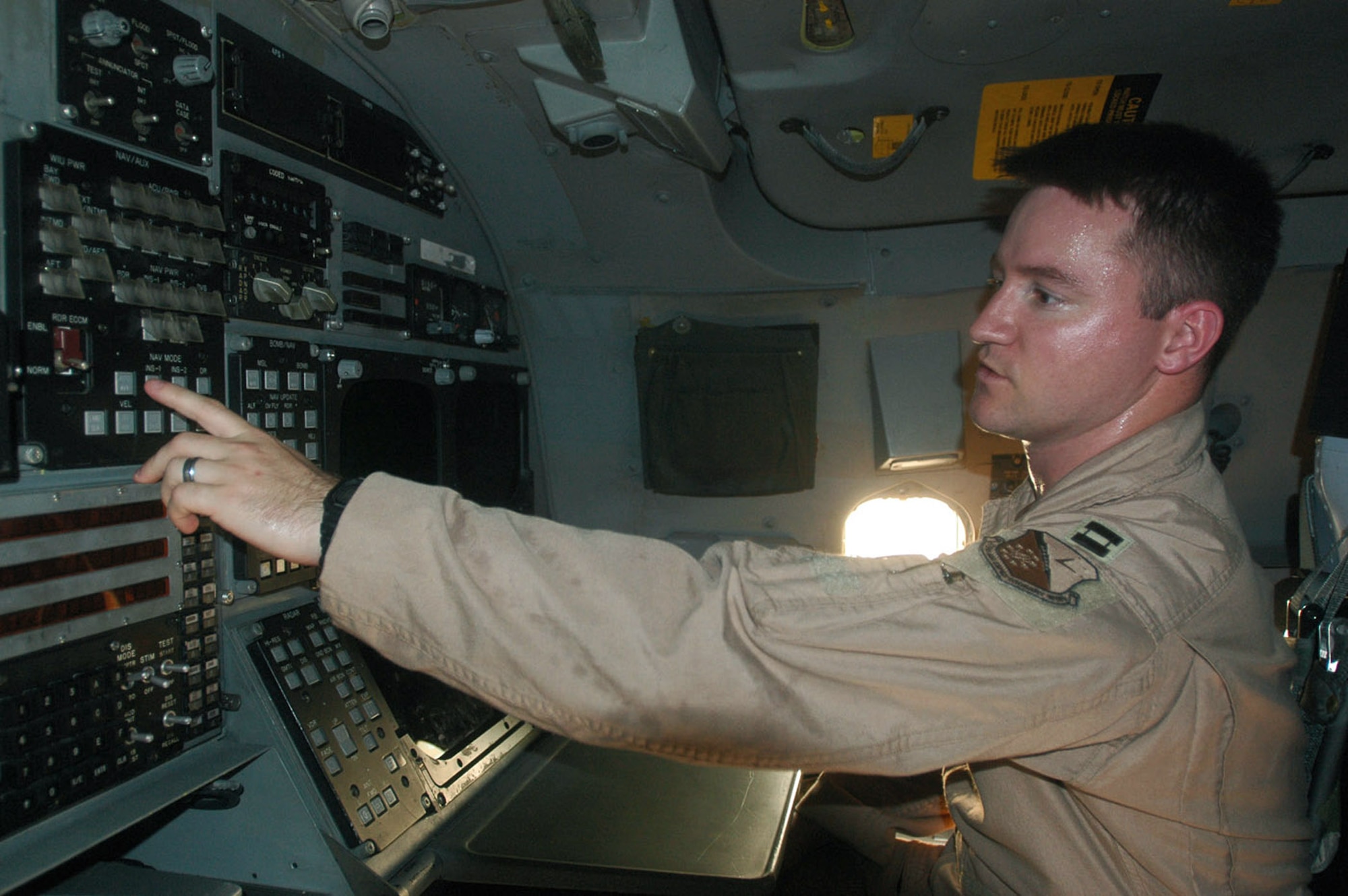 Capt. Matt Steele can arm and change a bomb's coordinates from his station on the flight deck of a B-1B Lancer. Captain Steele is a weapons system officer assigned to the 9th Expeditionary Bomb Squadron at a deployed location in Southwest Asia. (U.S. Air Force photo/Senior Airman Clark Staehle)