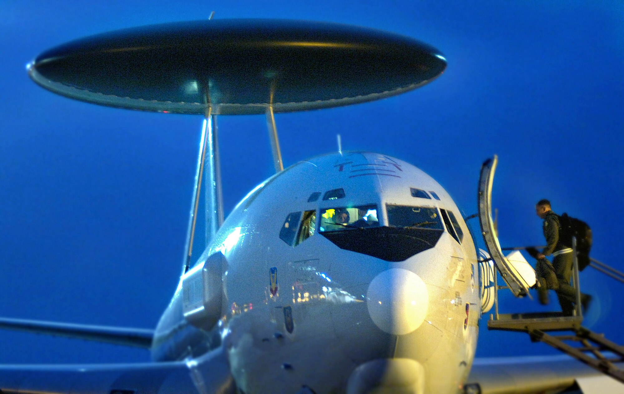 An E-3 Sentry airborne warning and control system aircrew member boards the surveillance aircraft before a mission over the eastern Pacific Ocean Aug. 1.  The aircraft, whose mission is to search of illegal drug runners, found five possible targets during the mission.  (U.S. Air Force photo/Tech. Sgt. Cecilio M. Ricardo)
