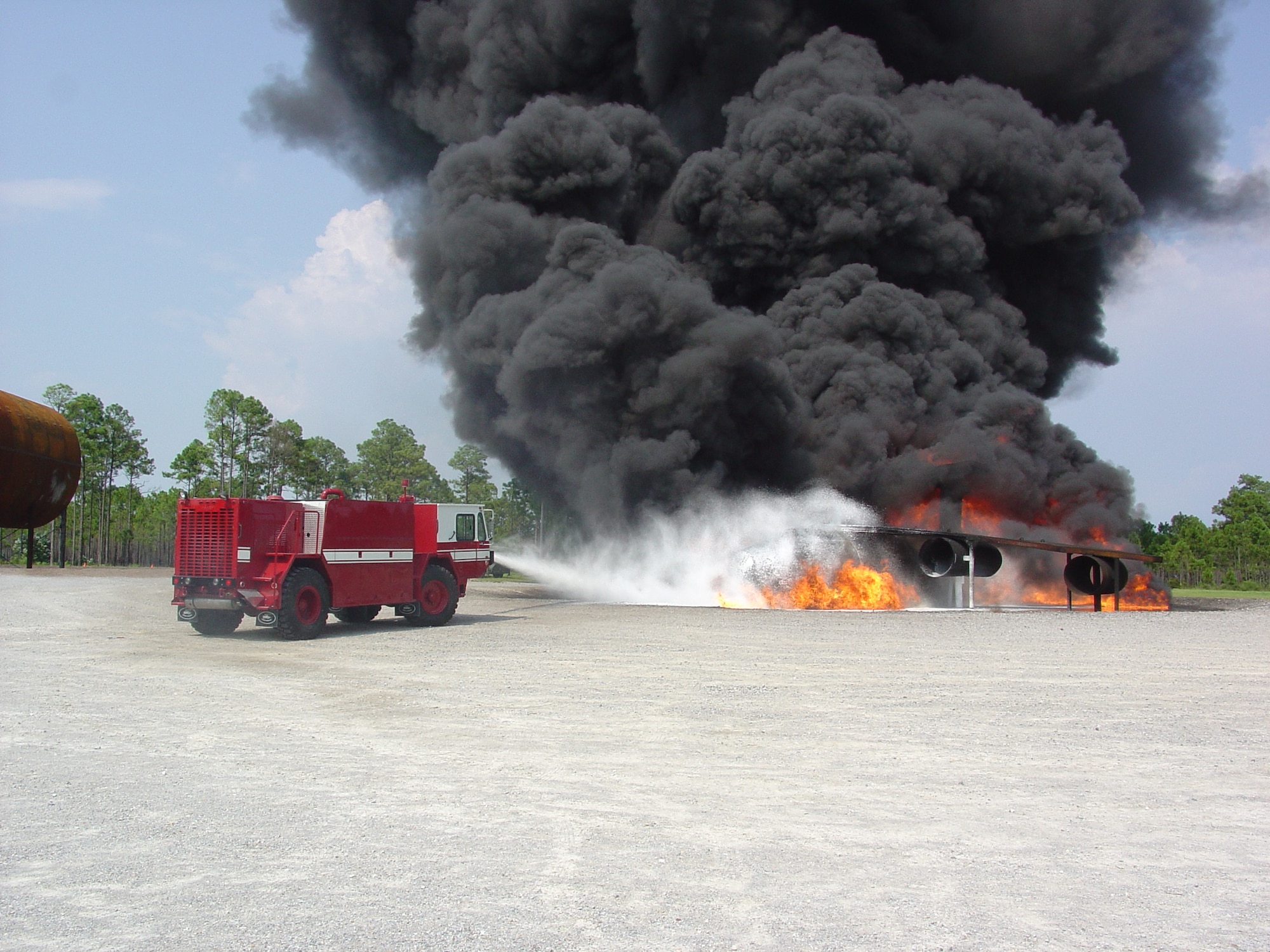 Air Force Research Laboratory has developed ultra high pressure firefighting technology that yields greater fire fighting capability from smaller, light-weight vehicles.  Here the UHP P-19 truck extinguishes a fire during testing at Tyndall Air Force Base, Fla. (U.S. Air Force photo)