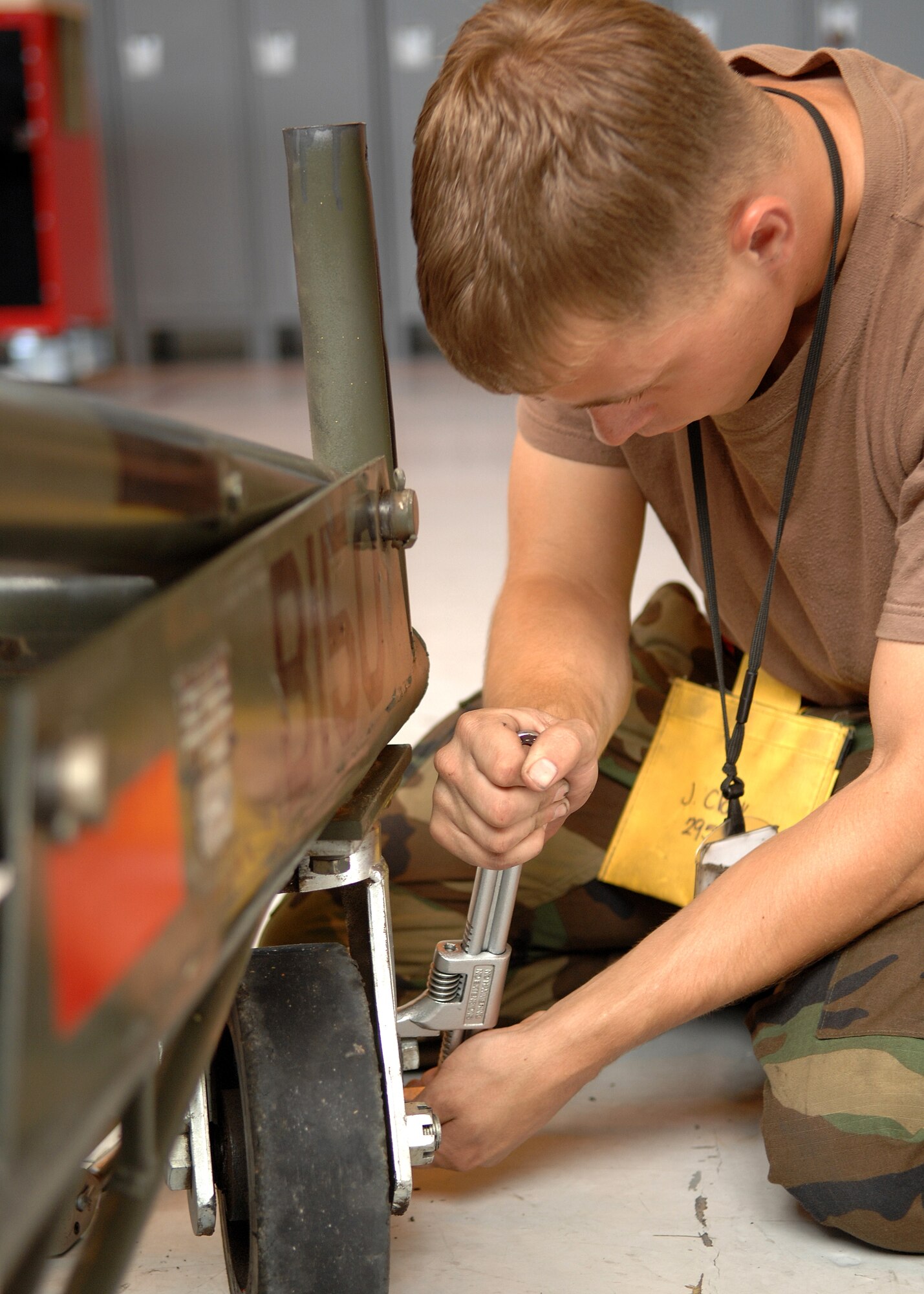Airman 1st Class Jeremiah Clark, 49th Maintenance Squadron, tightens the wheel on a piece of Aerospace Ground Equipment. (U.S. Air Force photo/Airman 1st Class John Strong)