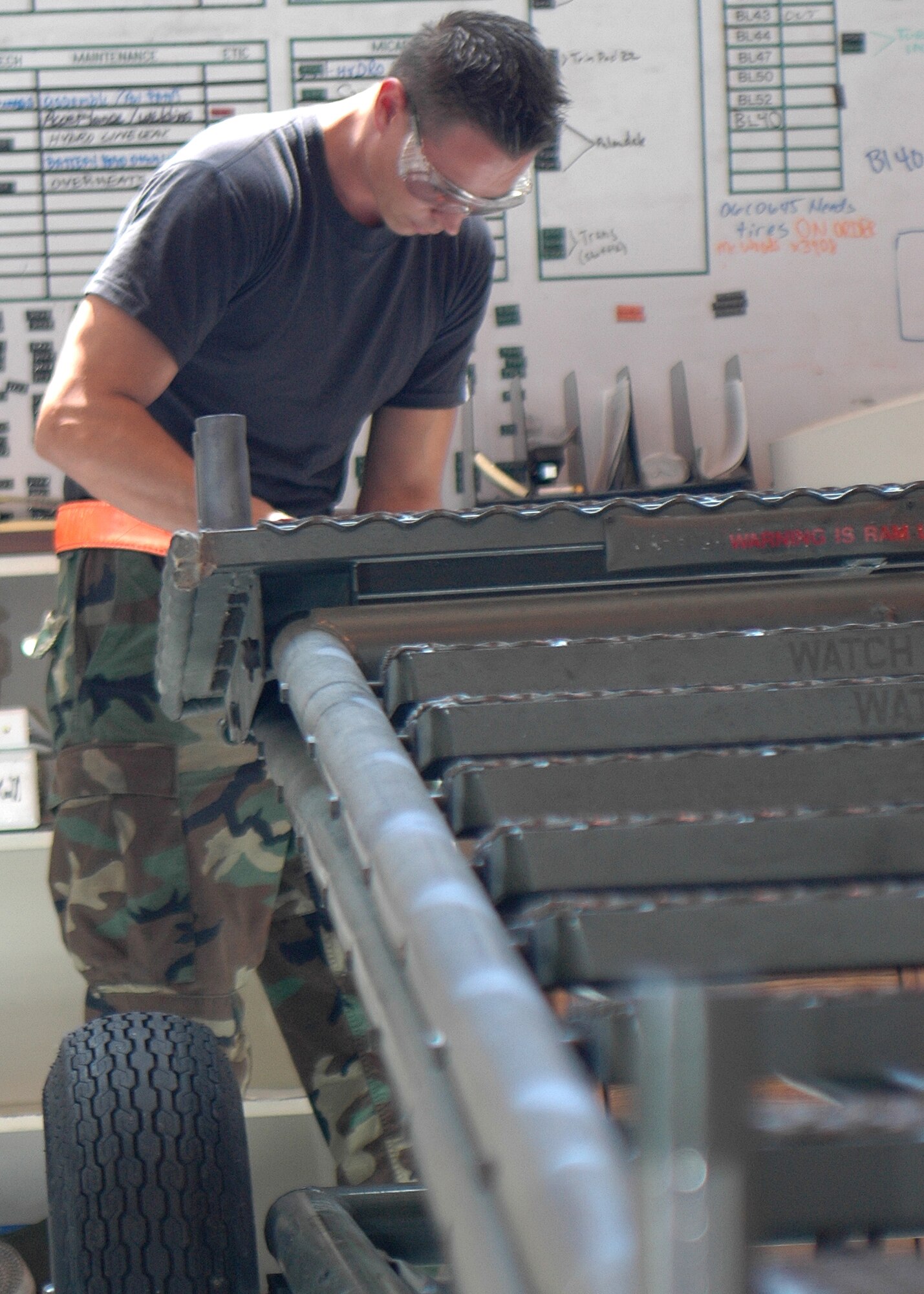 Staff Sgt. Mitch Bisson, 49th Maintenance Squadron, does a six-month inspection on a stand. Sergeant Bisson is part of the Aerospace Ground Equipment flight. (U.S. Air Force photo/Airman 1st Class Heather Stanton)