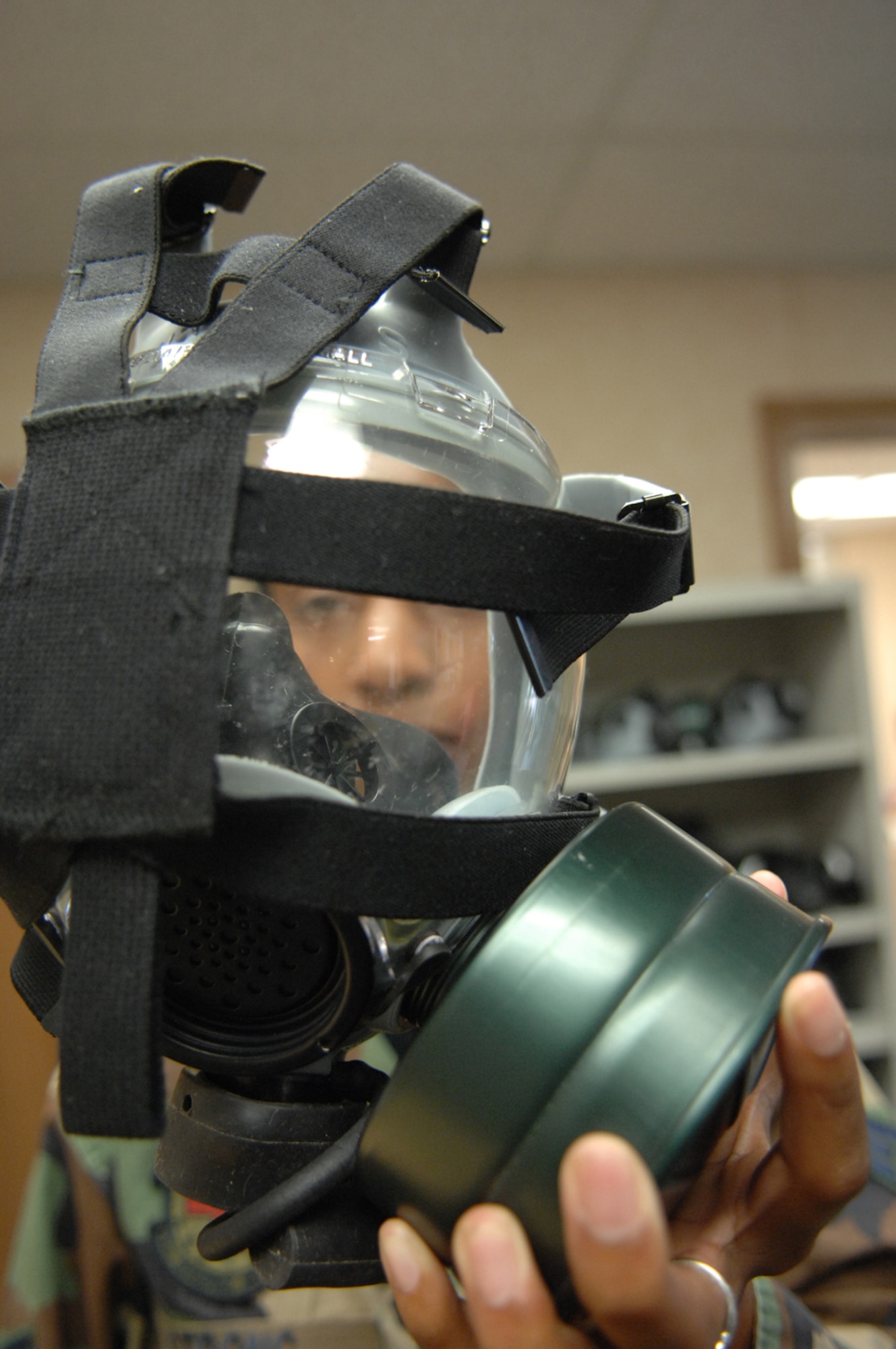 U.S. Air Force Senior Airman Tia Strong, 99th Aerospace Medical Squadron, prepares for a gas mask fit test July 31, 2007, Nellis AFB, Nev. Airmen have do a gas mask fit test done before deploying, ensuring the equipment they take into theater can save their lifes if necessary.
(U.S. Air Force photo by Senior Airman Larry E. Reid Jr.)
(Released)