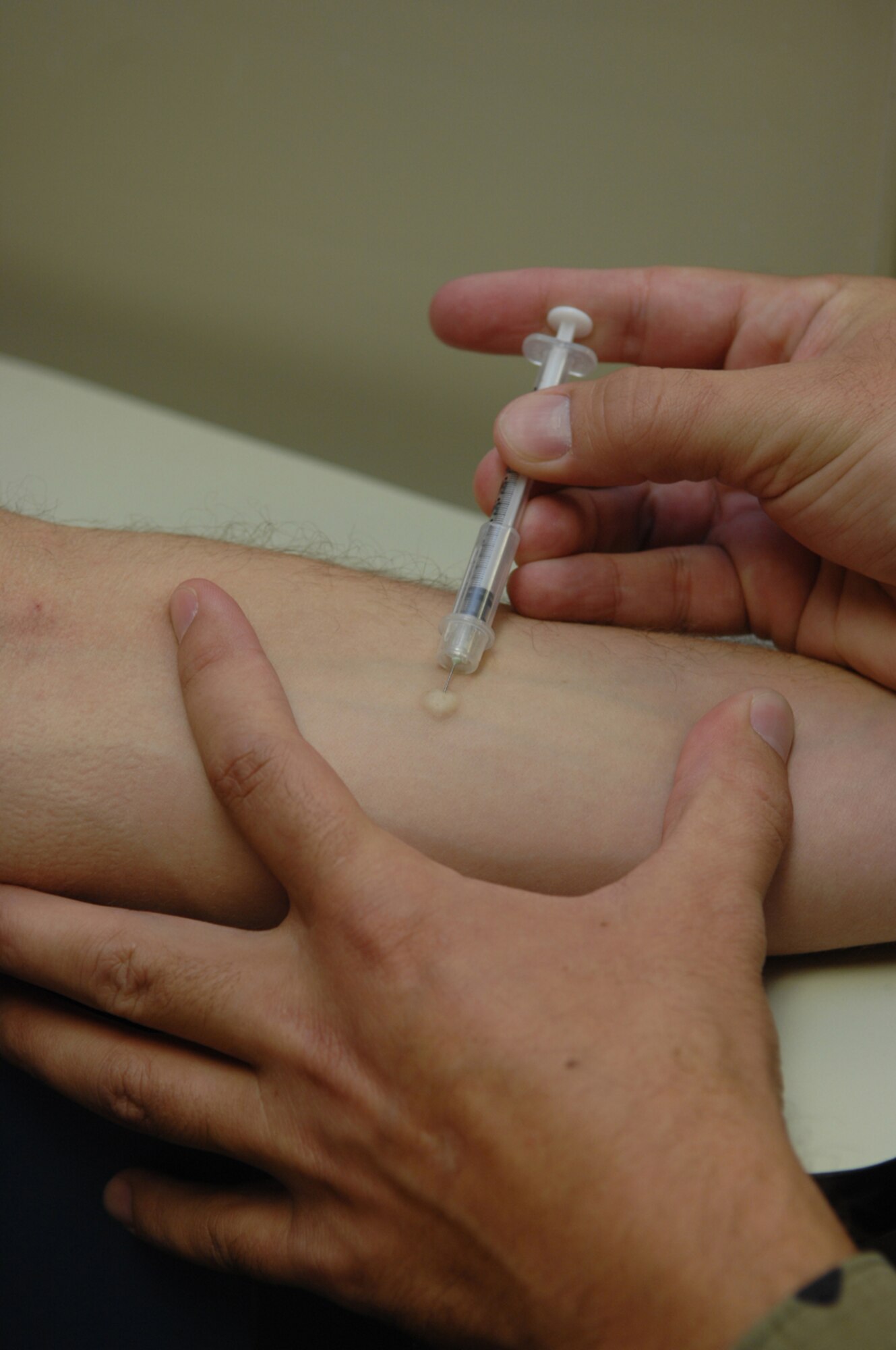 Immunizations are a must before any Airman is allowed to depart the country. Airmen are required to be familiarized with some of the situations they may find themselves in while deployed including chemical, biological, and nuclear warfare. 
(U.S. Air Force Photo by Airman 1st Class Nadine Y. Barclay)