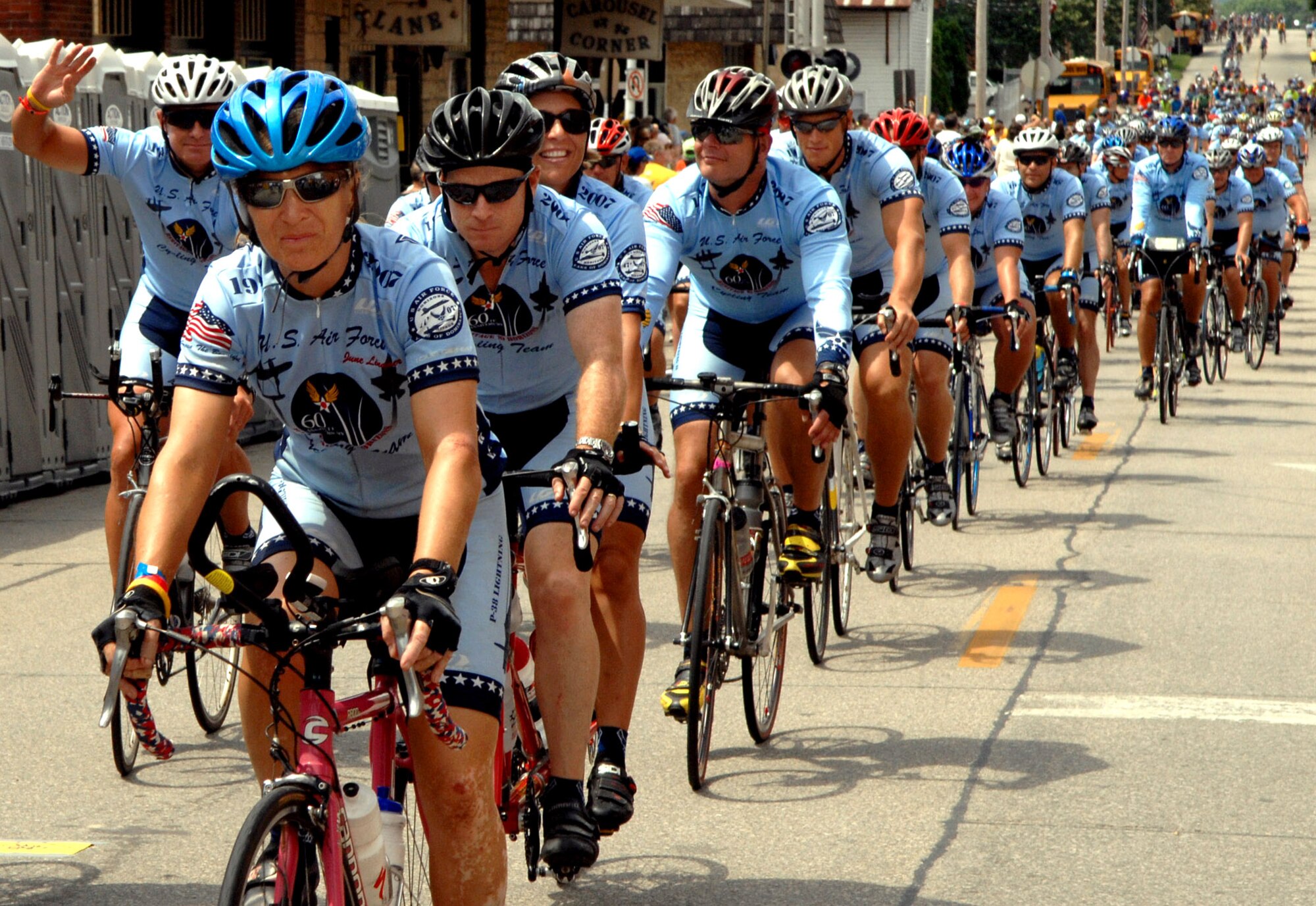Members of the Air Force Cycling Team ride into Bellevue, Iowa, as they complete the Des Moines Register's Annual Great Bicycle Ride Across Iowa, or RAGBRAI, July 28. Team members completed seven days of riding, maintaining an average of 70 miles a day, across the state of Iowa. (U.S. Air Force photo/Airman 1st Class Joanna M. Kresge)
