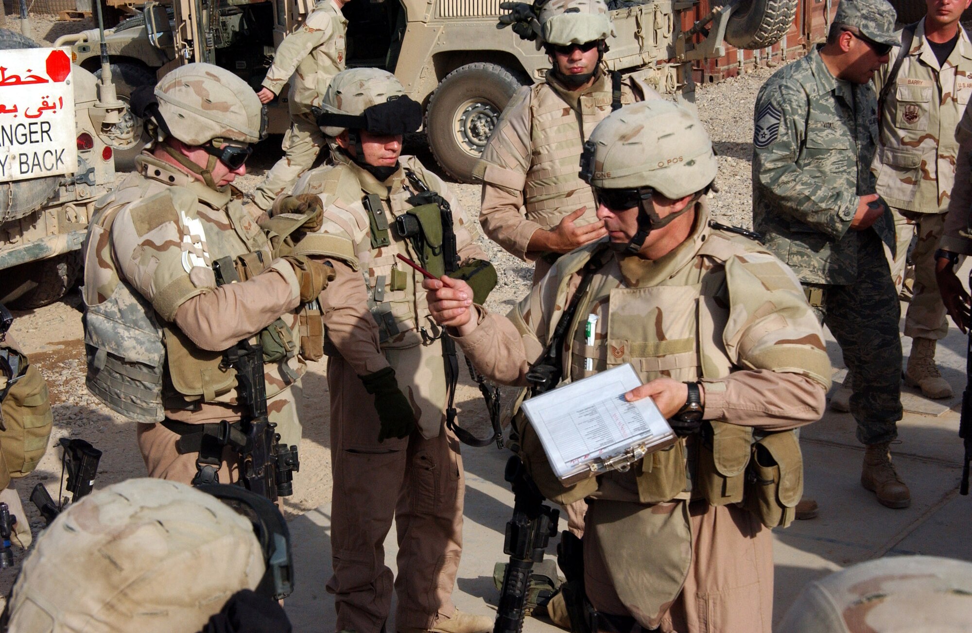 Tech Sgt. Richard Blackstone conducts an equipment inventory with a Police Transition Team before a mission at Contingency Operating Base Speicher, Iraq. Sergeant Blackstone, a squad leader for a District PTT security team, ensures each member of the team has all equipment needed for the mission. Sergeant Blackston is assigned to the 732nd Expeditionary Security Forces Squadron Det. 1. (U.S. Air Force photo/Master Sgt. Steve Horton)
