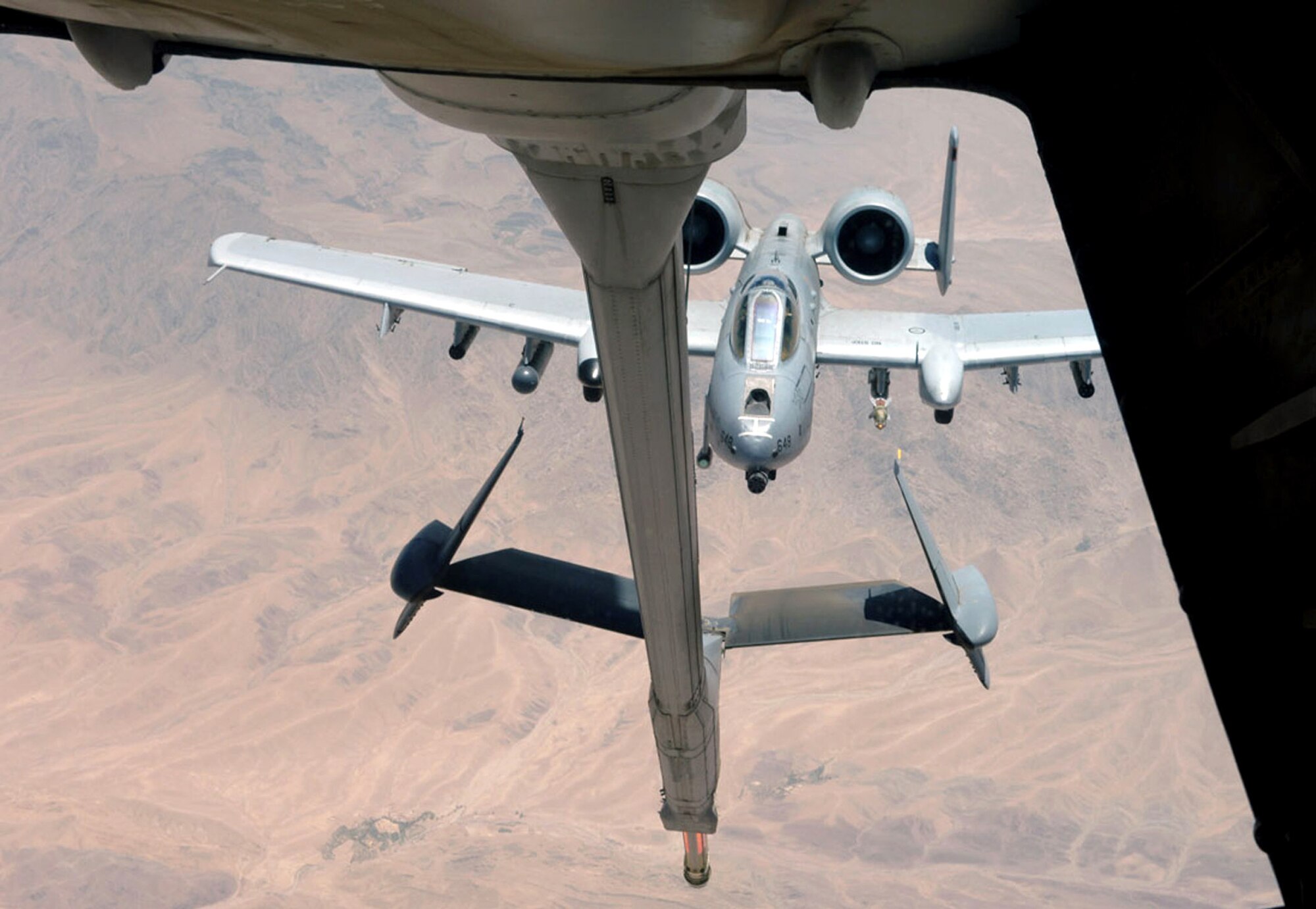 An A-10 Thunderbolt II prepares to make contact with a KC-10 Extender assigned to the 908th Expeditionary Air Refueling Squadron during an Operation Enduring Freedom mission July 25.  A-10s provide close-air support for both OEF and Operation Iraqi Freedom.  KC-10s also offload fuel to coalition aircraft around the area of responsibility.  Tankers offloaded two million pounds of fuel Aug. 2 to more than 175 aircraft.   (U.S. Air Force by Airma 1st Class Matt Cook)
