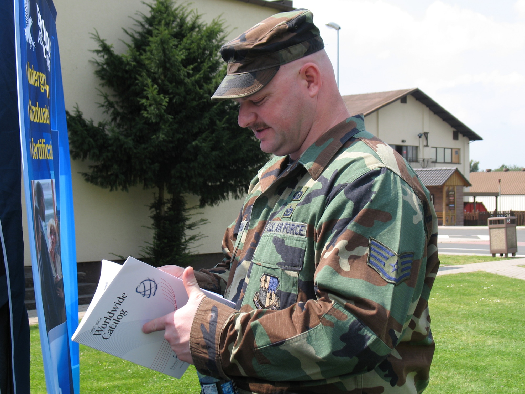 SPANGDAHLEM AIR BASE, Germany – Staff Sgt. Troy Triminal, 52nd Mission Support Squadron, reviews a broacher from Embry Riddle Aeronautical University at an education fair Aug. 3. (US Air Force photo/Staff Sgt. Tammie Moore)