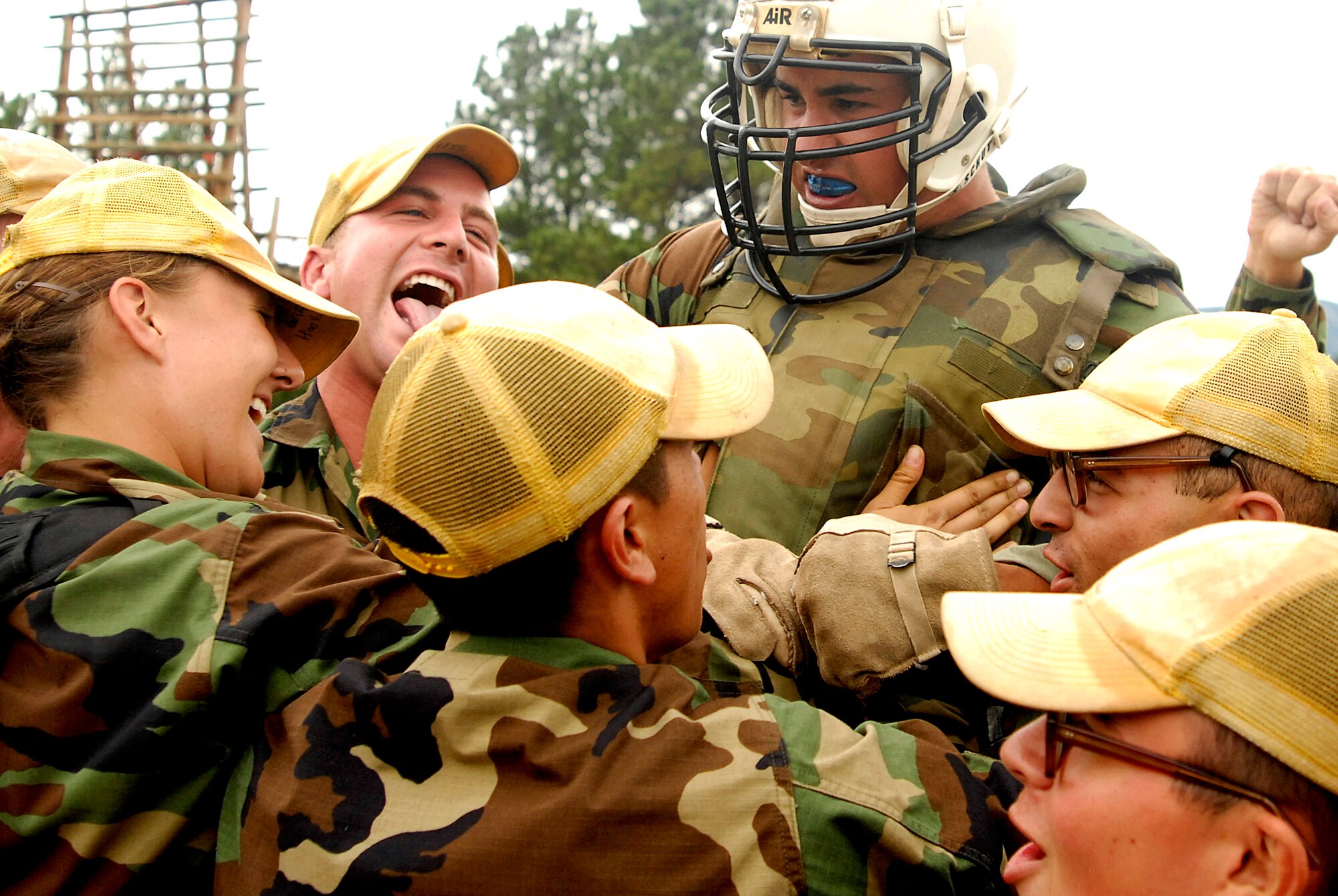 Academy basic cadet trainee Griffin Biscone is mobbed by members of his squadron July 28 at the U.S. Air Force Academy, Colo., after winning the title of "Big Bad Basic," a single-elimination tournament where contestants battle one another with pugil sticks. (U.S. Air Force photo/Mike Kaplan)